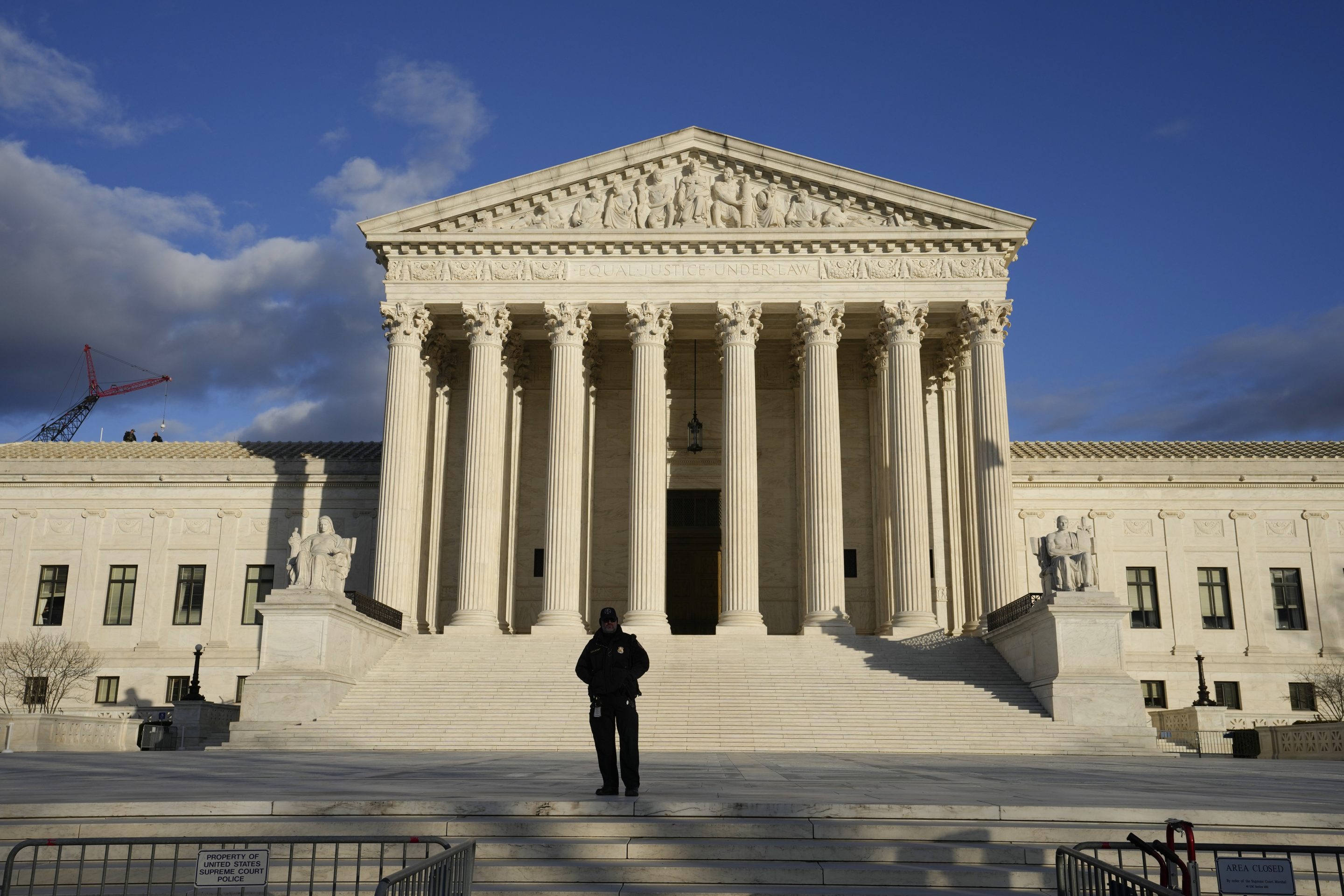 Security stands outside the Supreme Court, Jan. 20, 2023, in Washington.