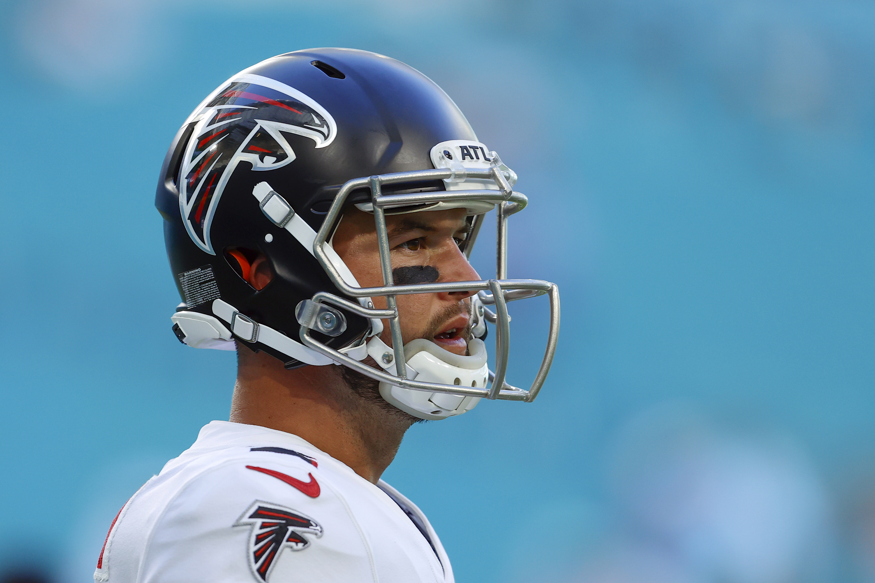 AJ McCarron in Atlanta Falcons kit watching a game