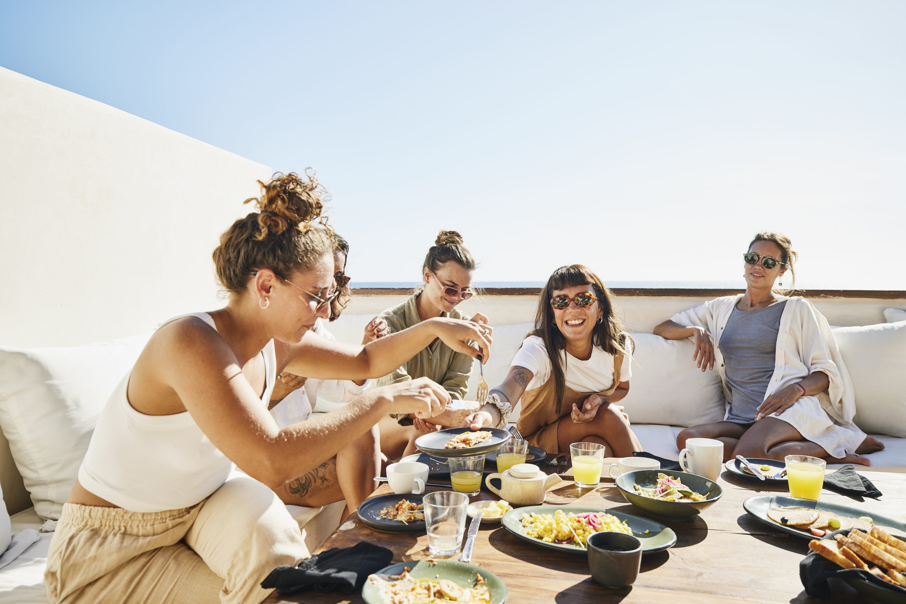Friends sharing a meal on vacation.