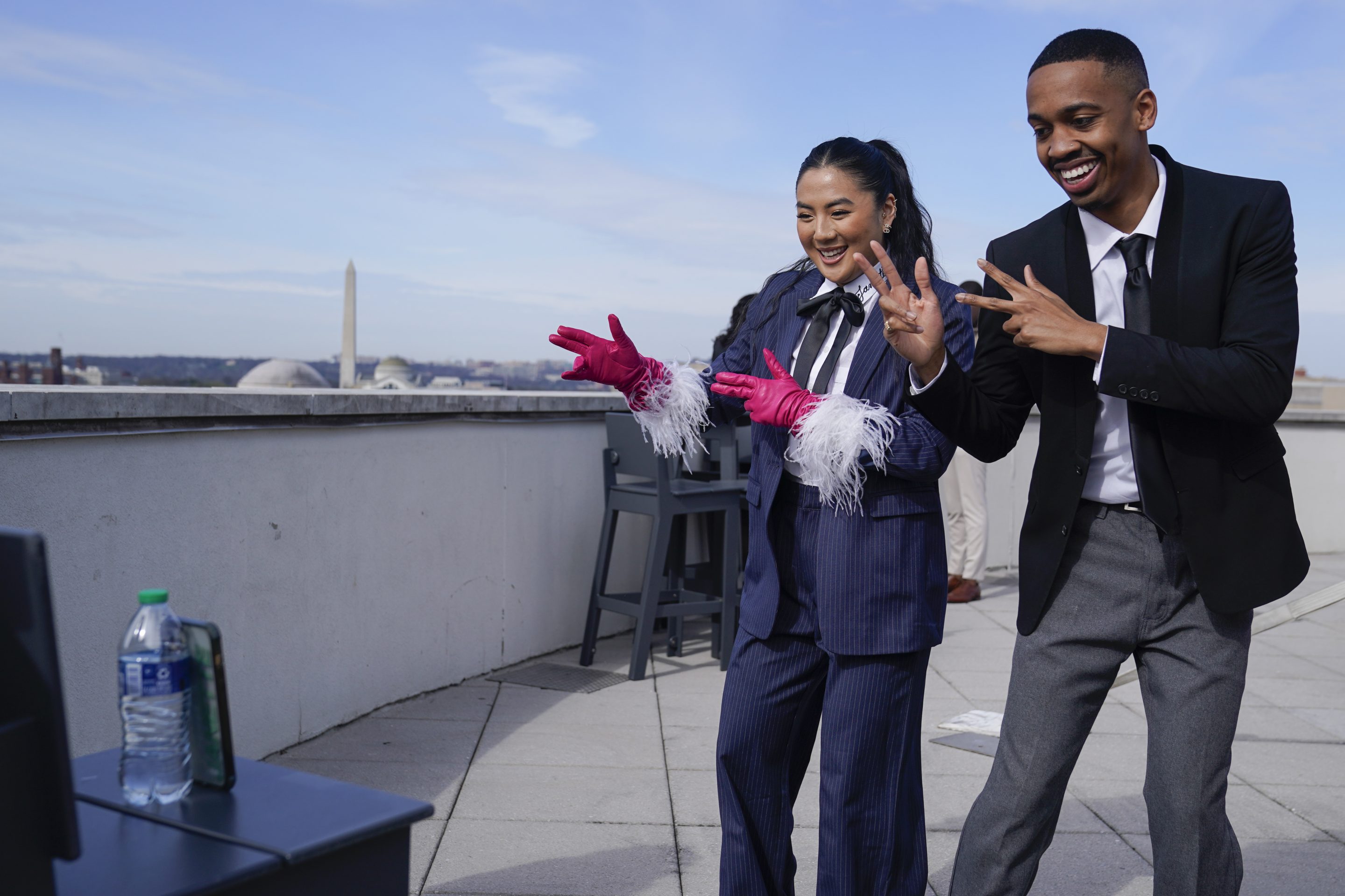 TikTok influencers Janette Ok and Imani Carrier record a video during a media availability, Wednesday, March 22, 2023, in Washington.