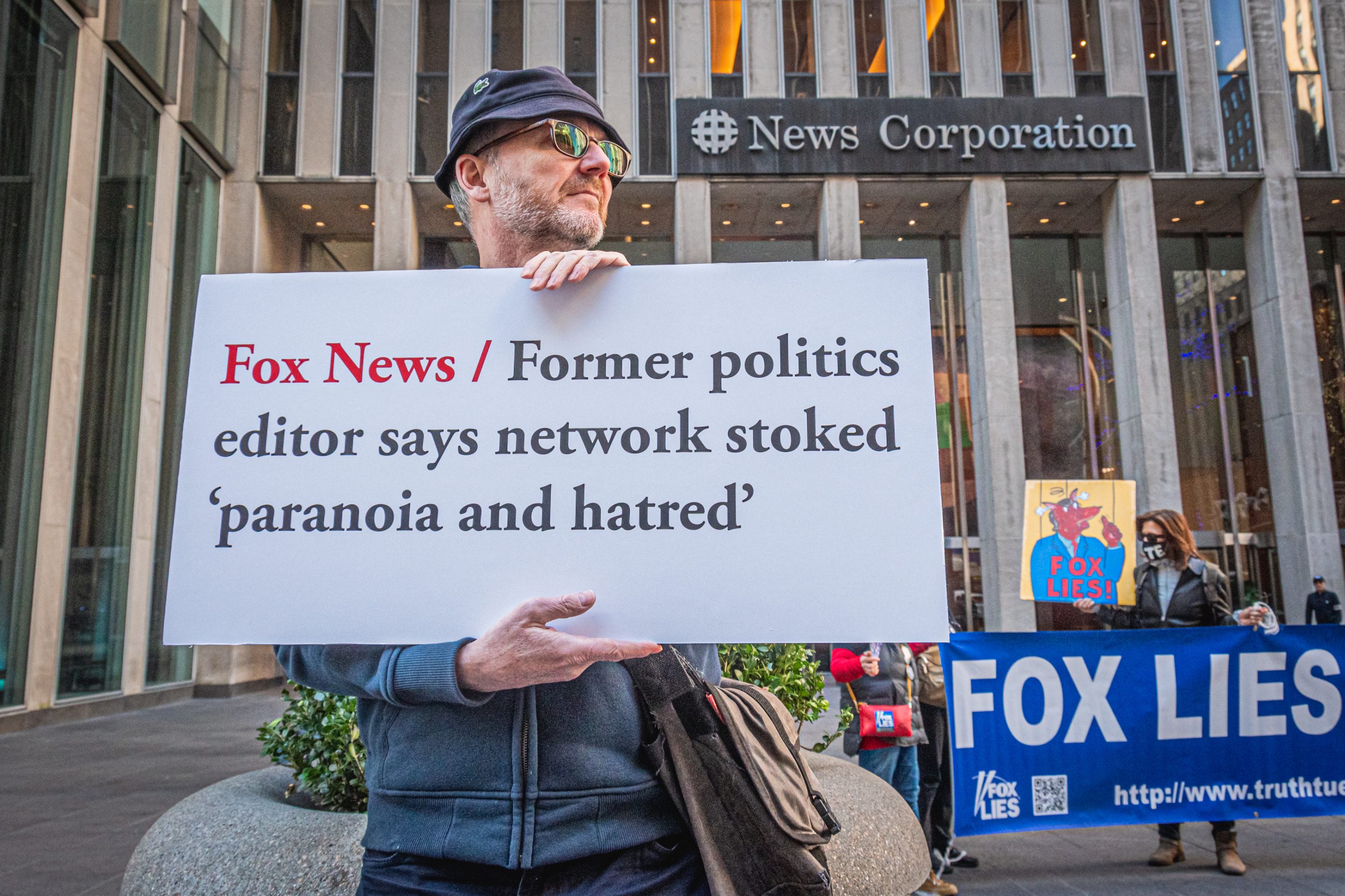 Protesters demonstrating outside Fox News' New York headquarters in 2022