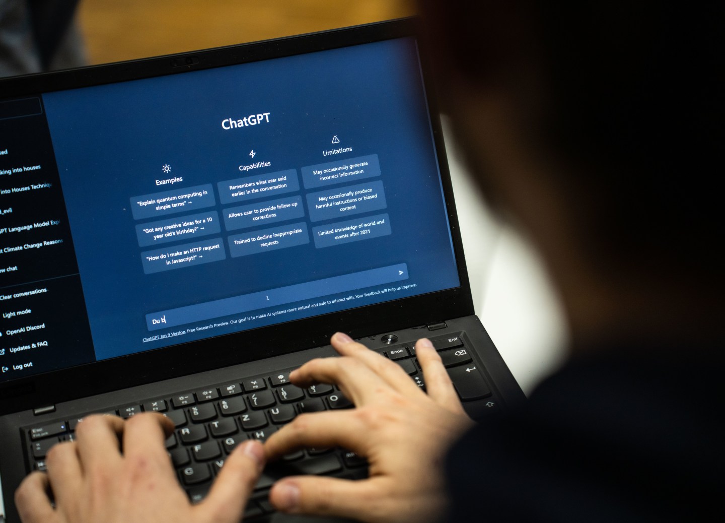 The text software ChatGPT. Man typing on a computer.