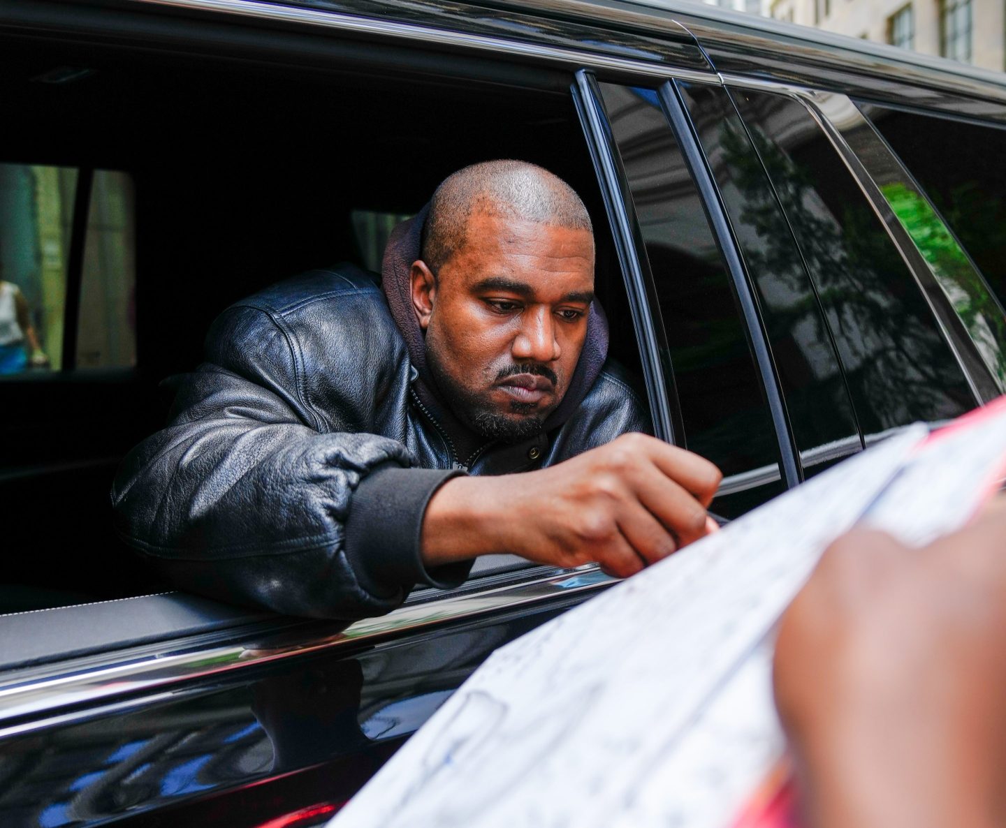 Kanye West arrives at the Balenciaga show
