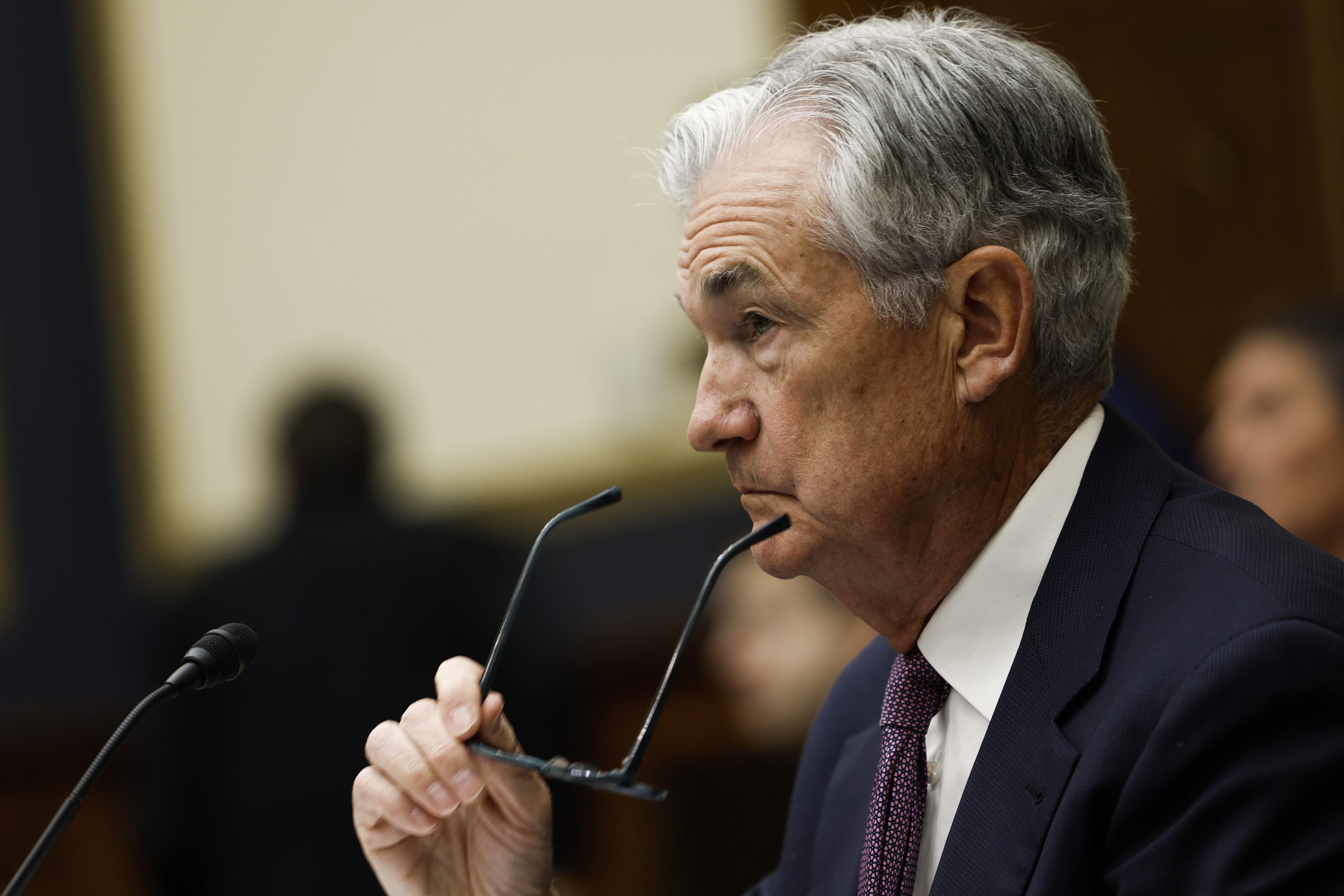 Federal Reserve Chair Jerome Powell removes his glasses as he testifies before the House Committee on Financial Services on Capitol Hill on March 8, 2023 in Washington, DC.