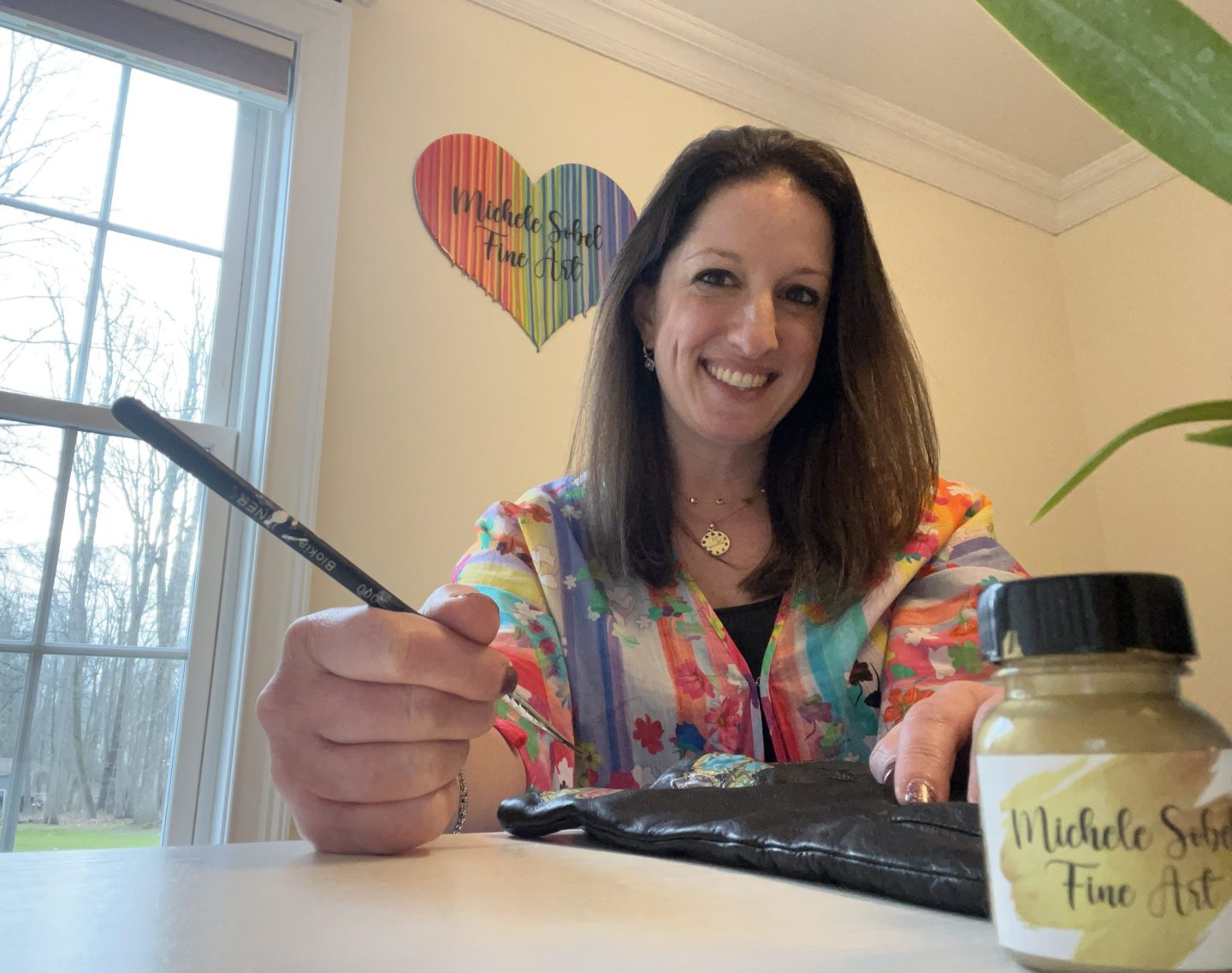 How an entrepreneur turned a side hustle charging up to $1,000 to paint on luxury handbags into a career