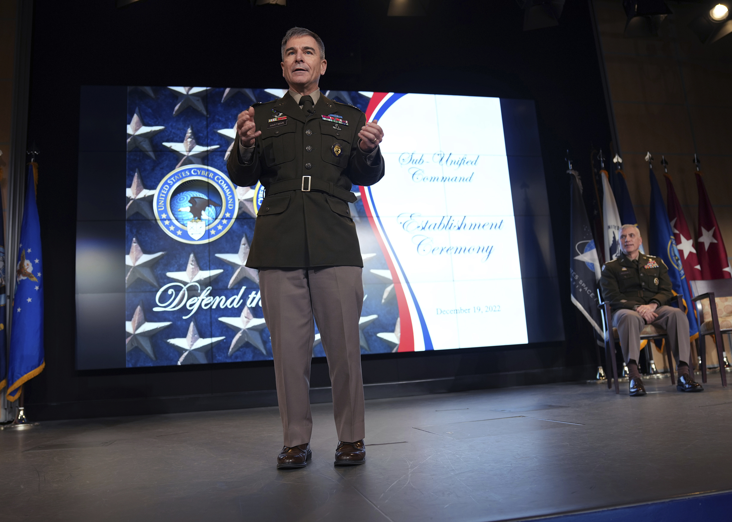 In this image provided by U.S. Cyber Command, Army Major Gen. William Hartman, commander of U.S. Cyber Command's Cyber National Mission Force, speaks during a ceremony at U.S. Cyber Command headquarters at Fort George E. Meade, Md., on Dec. 19, 2022.