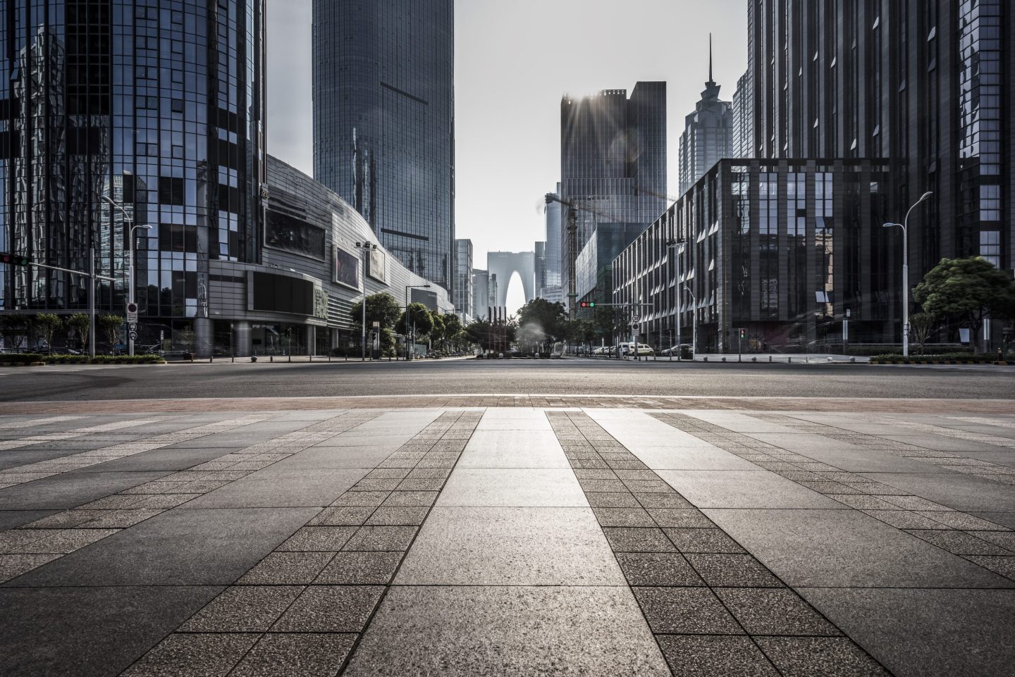 Photo of pavement and commercial properties.