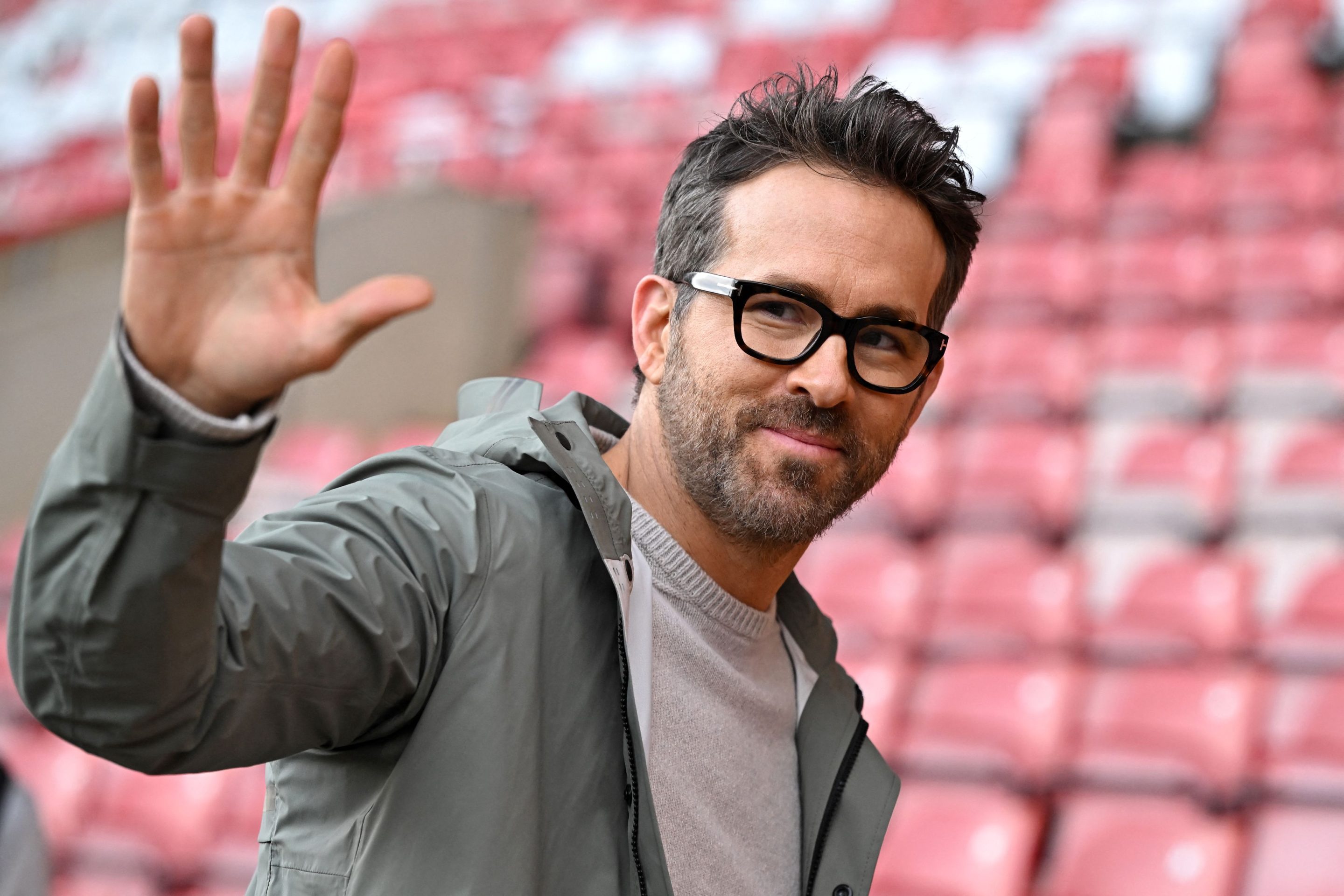 Actor and Wrexham owner Ryan Reynolds waves to fans ahead of the English FA Cup fourth-round football match between Wrexham and Sheffield United in Wrexham, north Wales, on Jan. 29, 2023.