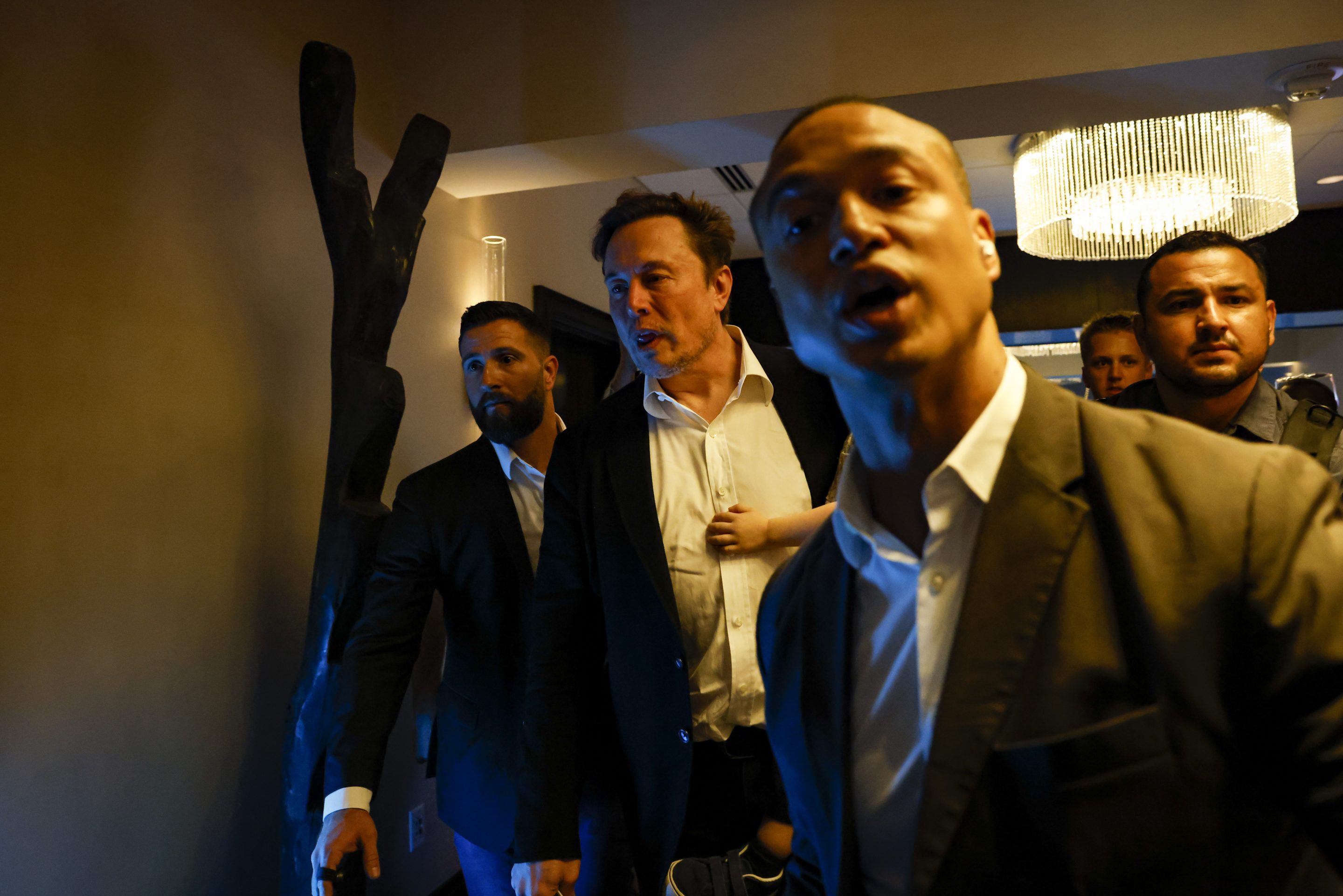 Elon Musk, CEO of Tesla (center), during the MMA Global Possible conference in Miami, April 18, 2023.
