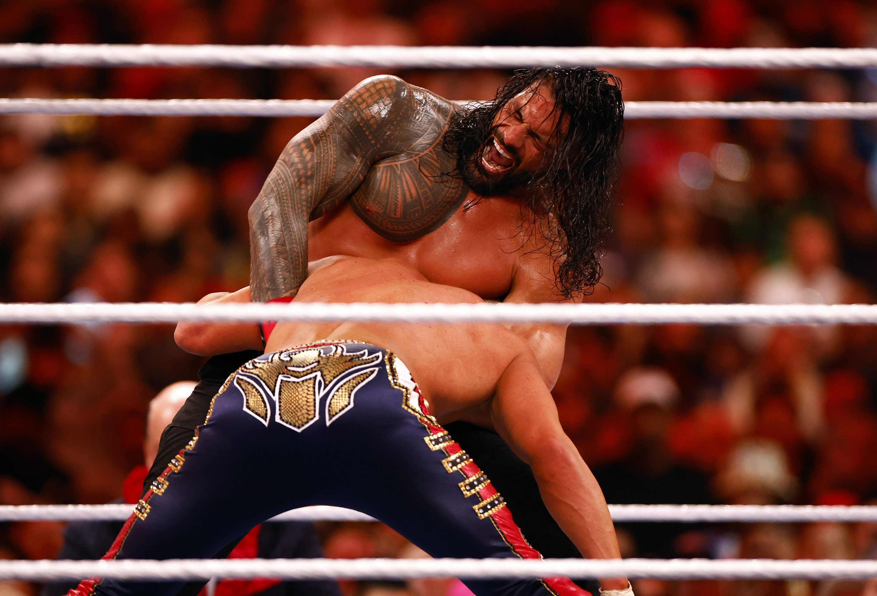 Roman Reigns wrestles Cody Rhodes