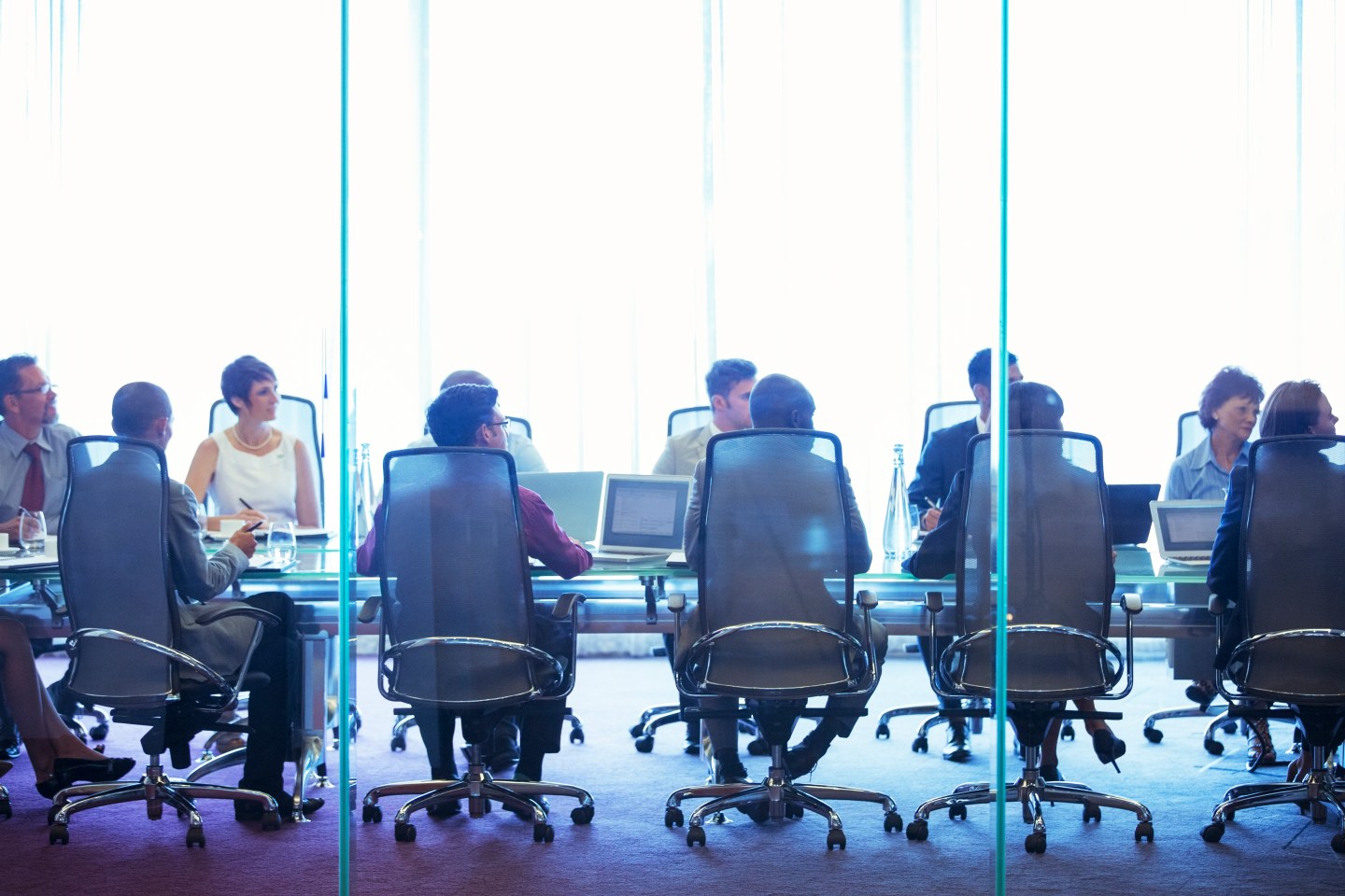 Business people having meeting in conference room.