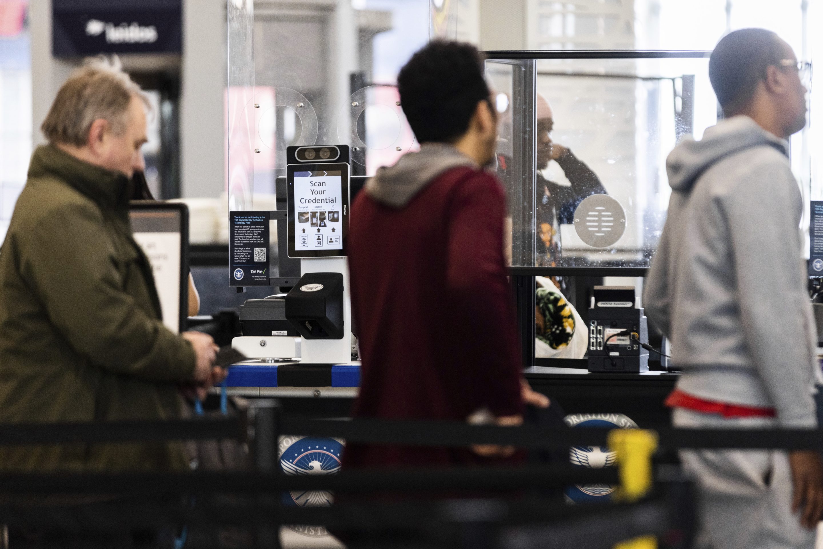 Travelers wait in line at a Baltimore-Washington International Thurgood Marshall Airport security checkpoint to use the Transportation Security Administration's new facial recognition, Wednesday, April 26, 2023, in Glen Burnie, Md.