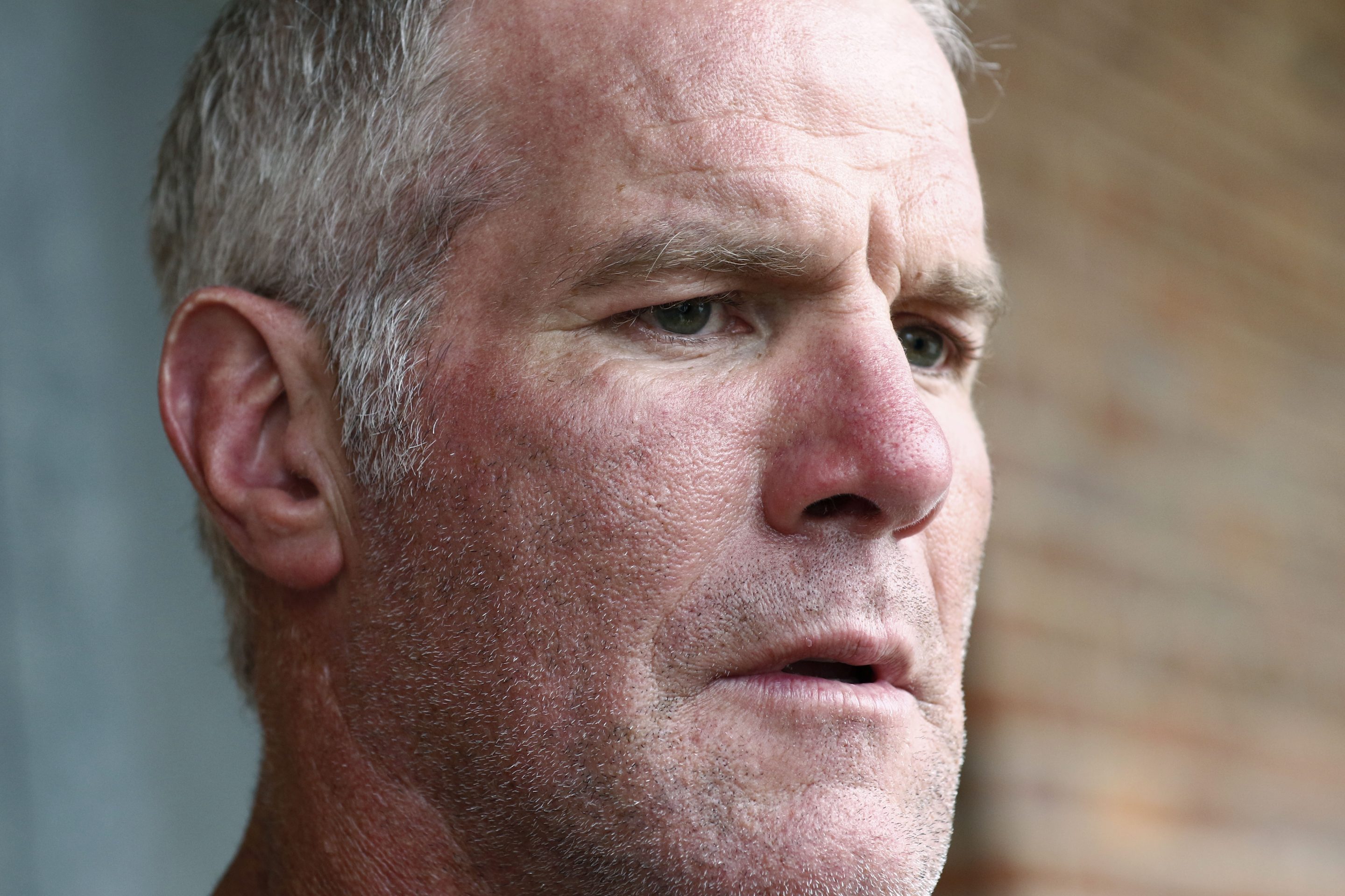 Former NFL quarterback Brett Favre speaks to the media in Jackson, Miss., Oct. 17, 2018.