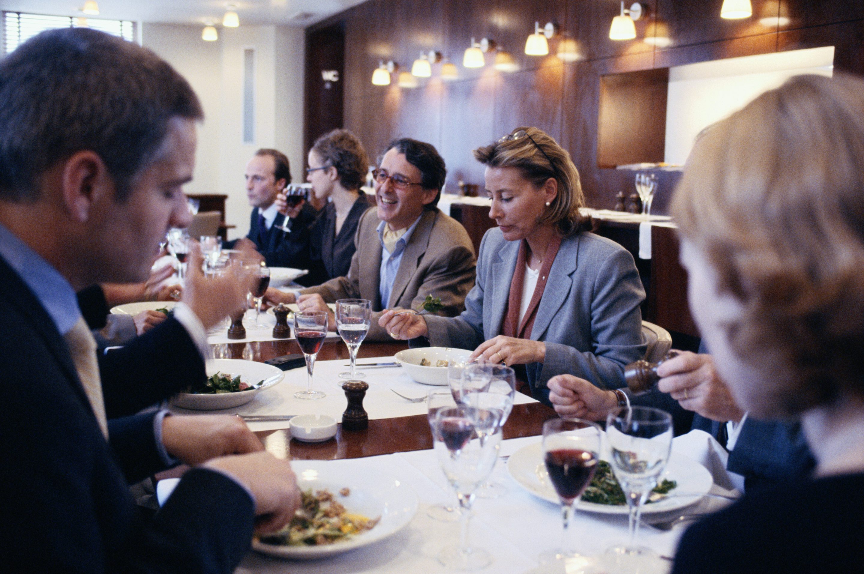 Coworkers eating at a restaurant.