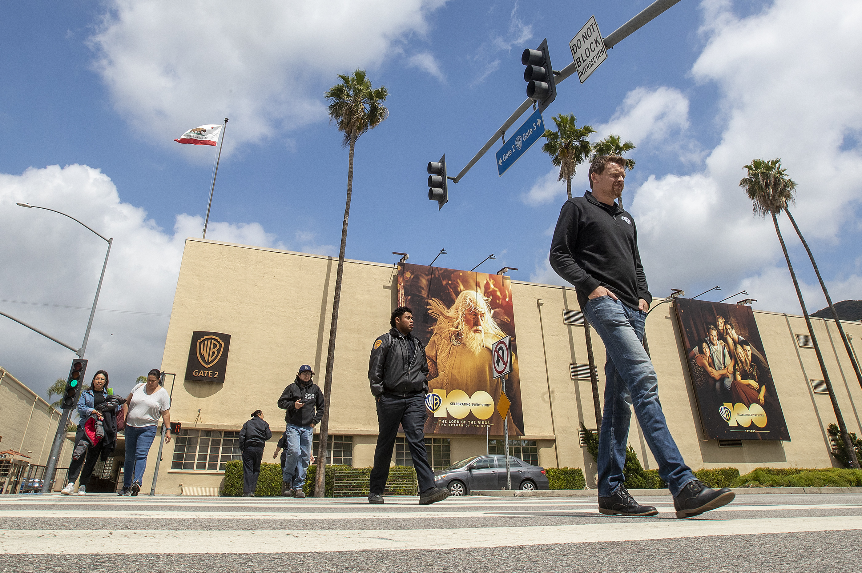 People make their way to the parking garage after leaving Warner Bros. Studios in Burbank on May 1, 2023. Writers Guild of America members voted overwhelmingly to authorize a strike if labor negotiations break down.
