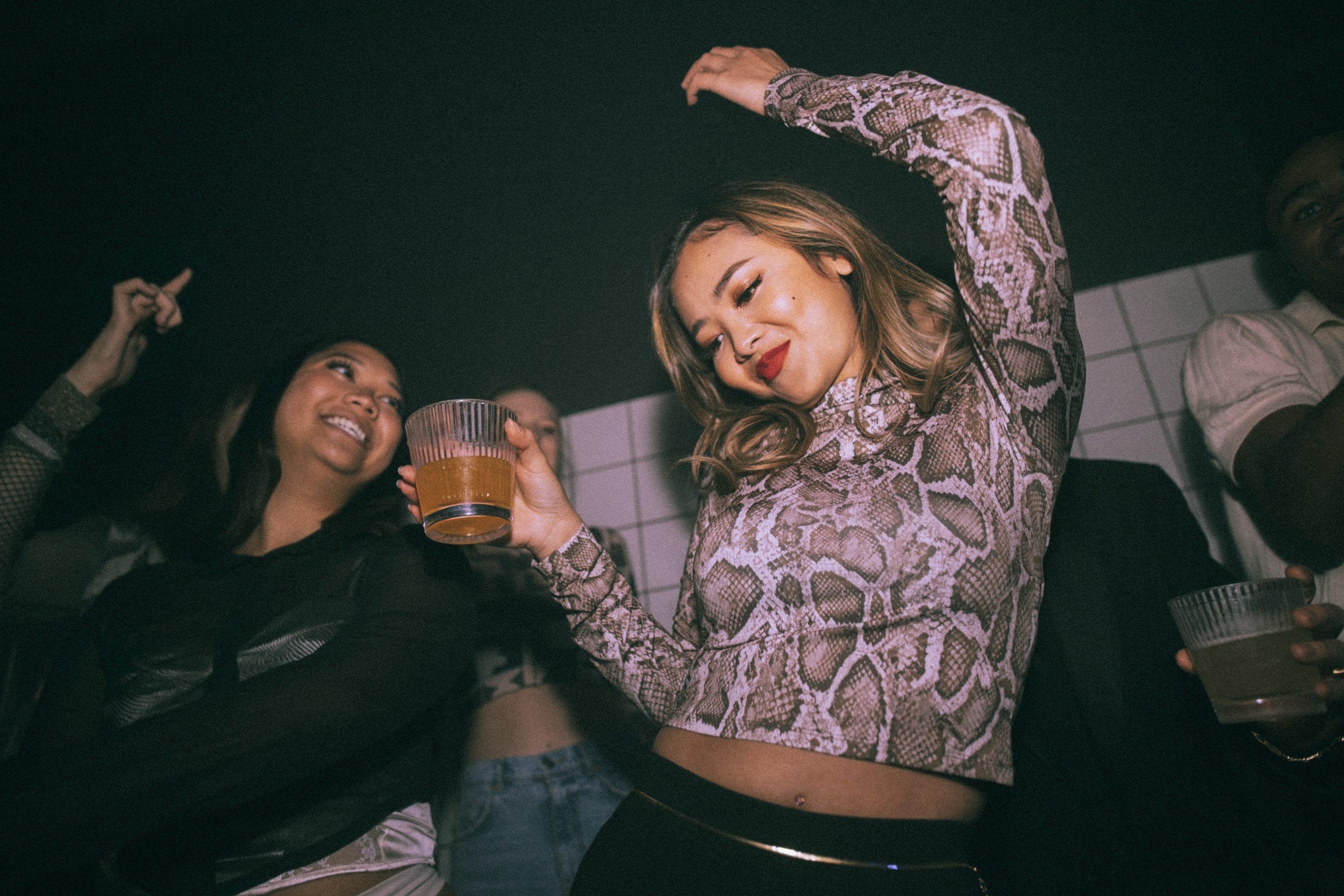 A woman dancing in a night club. 