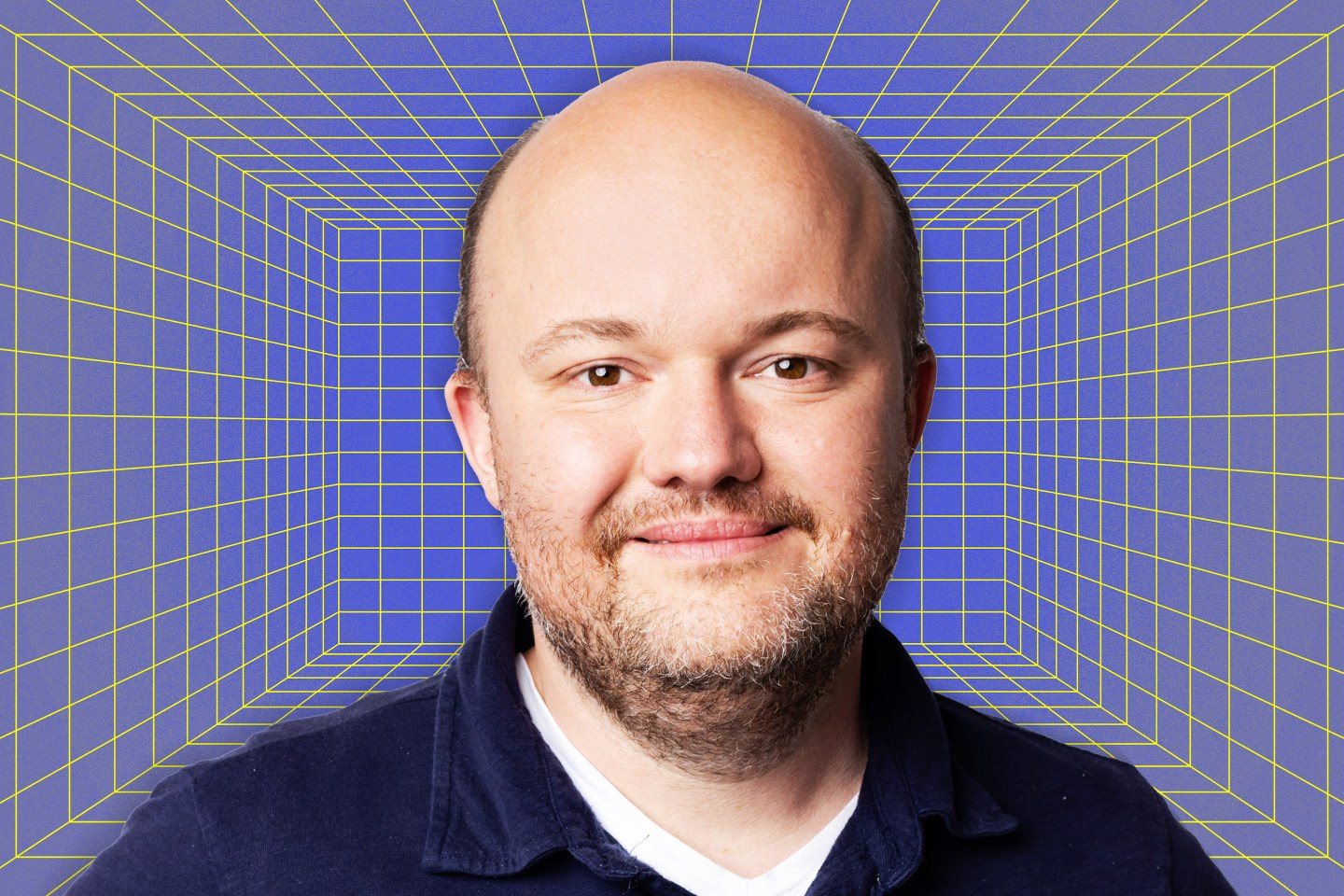 A headshot of Zac Townsend in front of a computer-themed background.