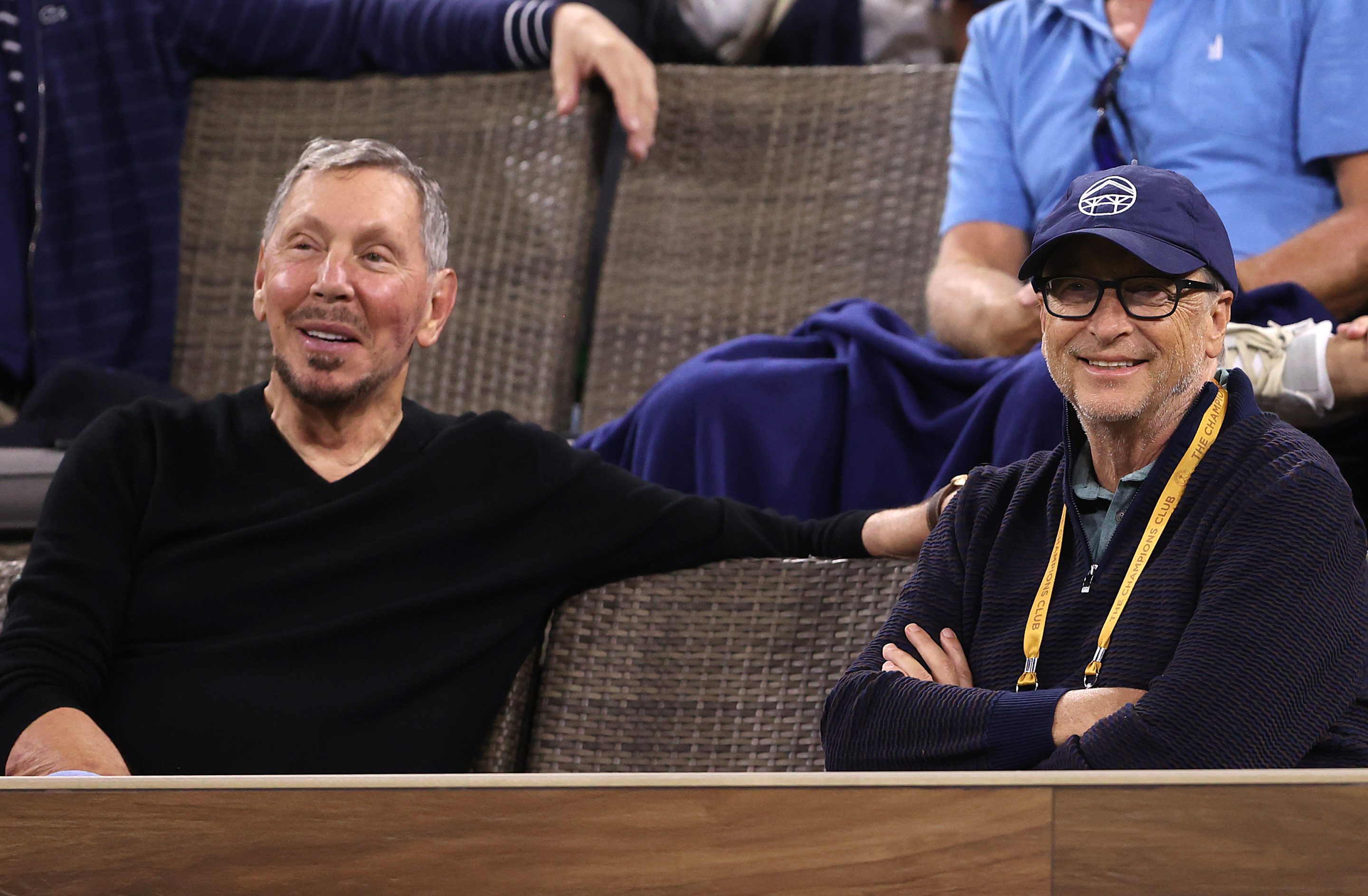 Larry Ellison and Bill Gates watch a tennis match together. 