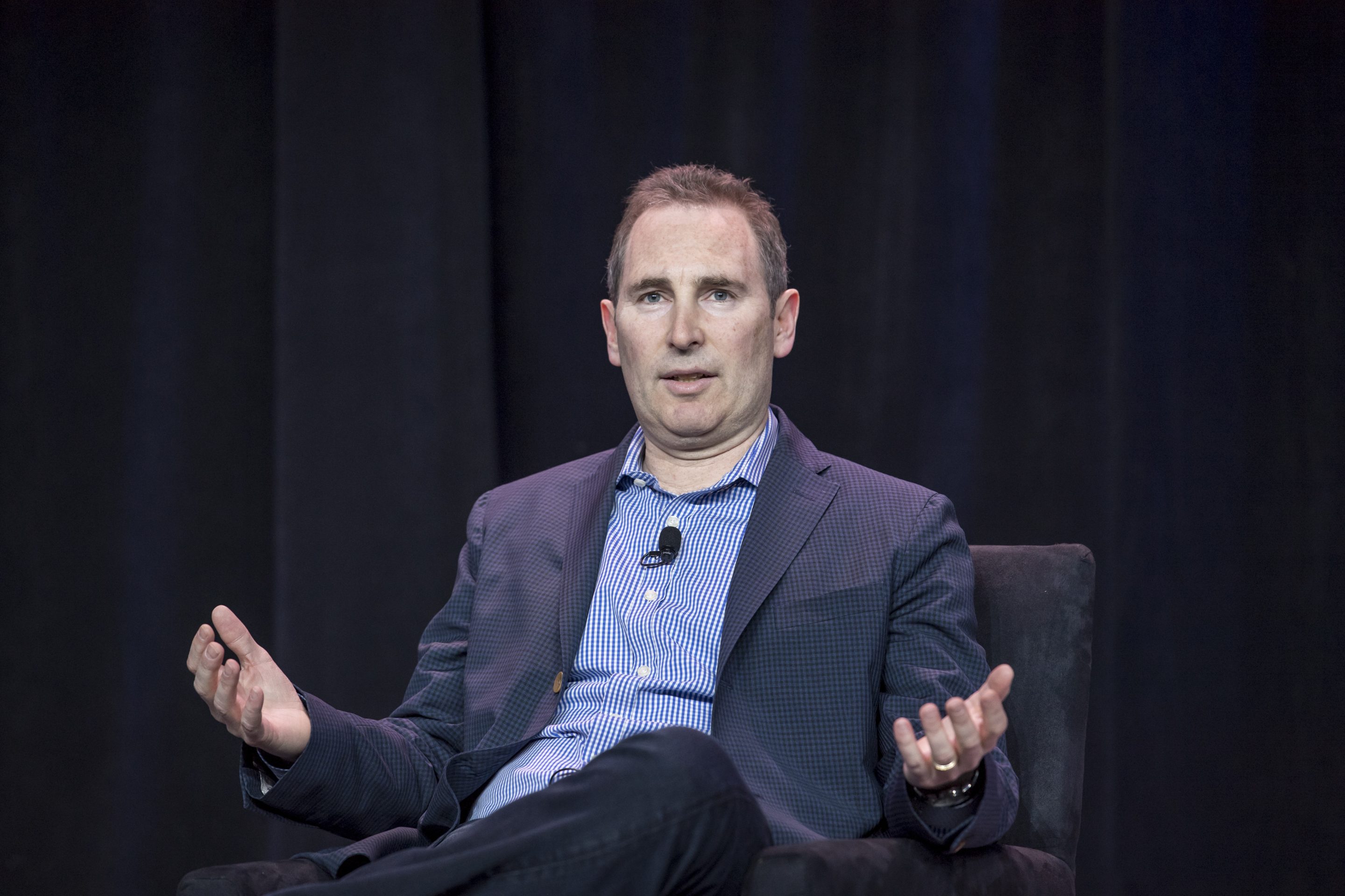Amazon CEO Andy Jassy on stage at an event.
