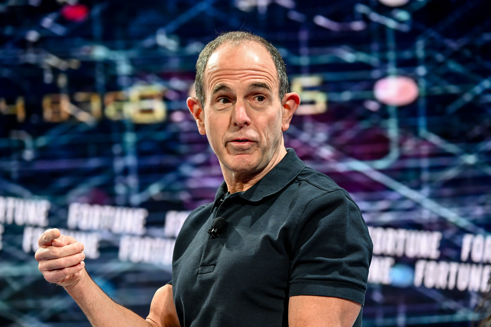 Man in black shirt standing on stage