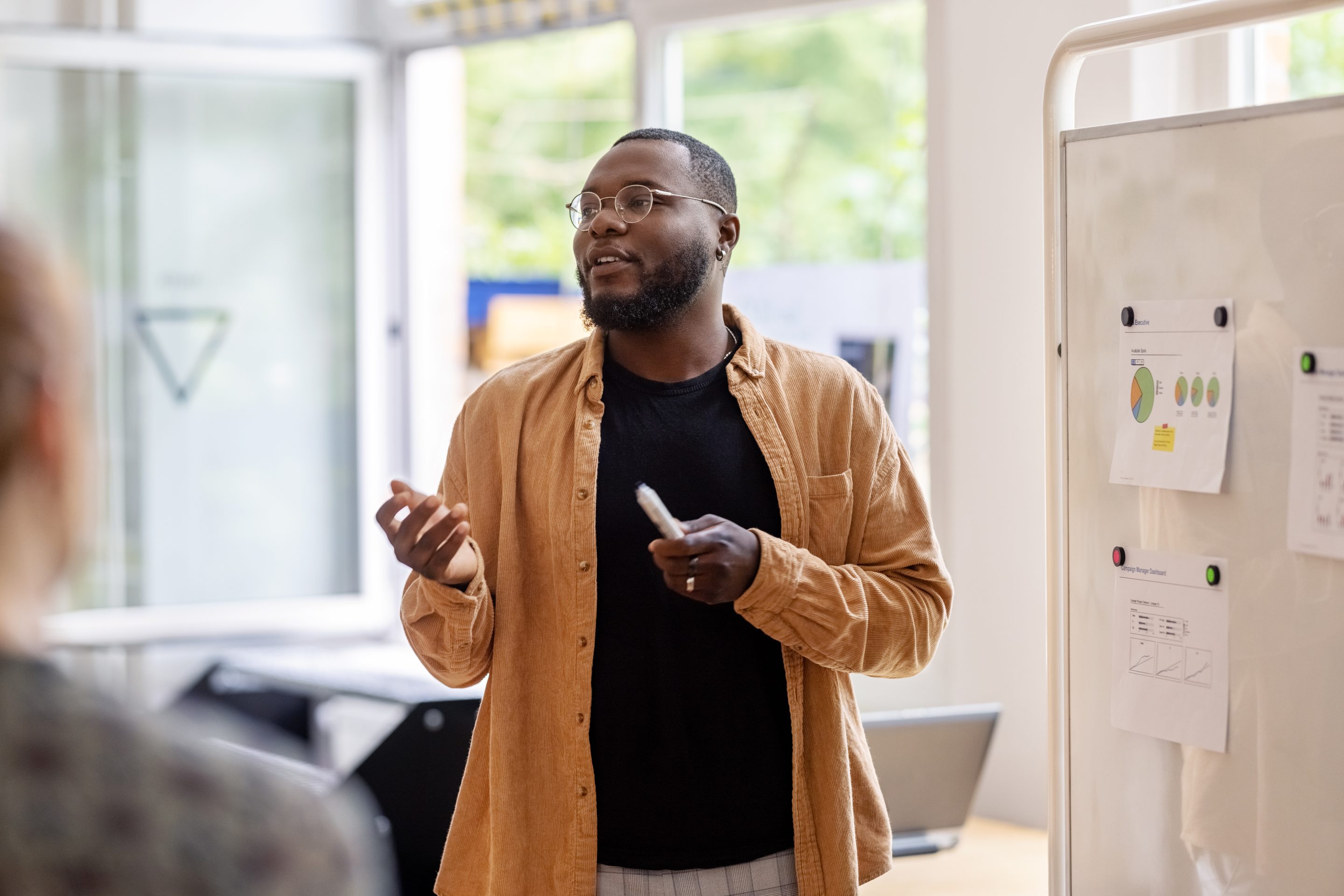 Man giving a presentation to a team.