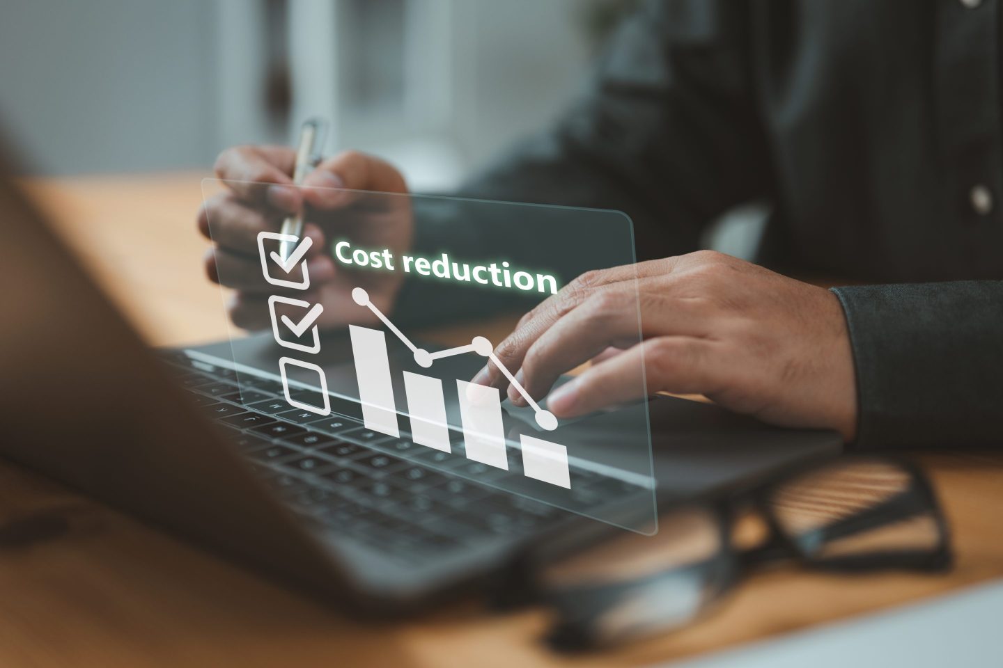 businessman using a computer to view a graph