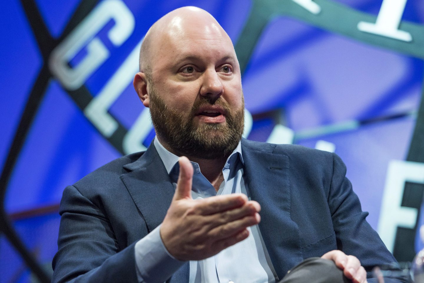 Cofounder of venture capital firm a16z Marc Andreesen speaking on stage at a conference.