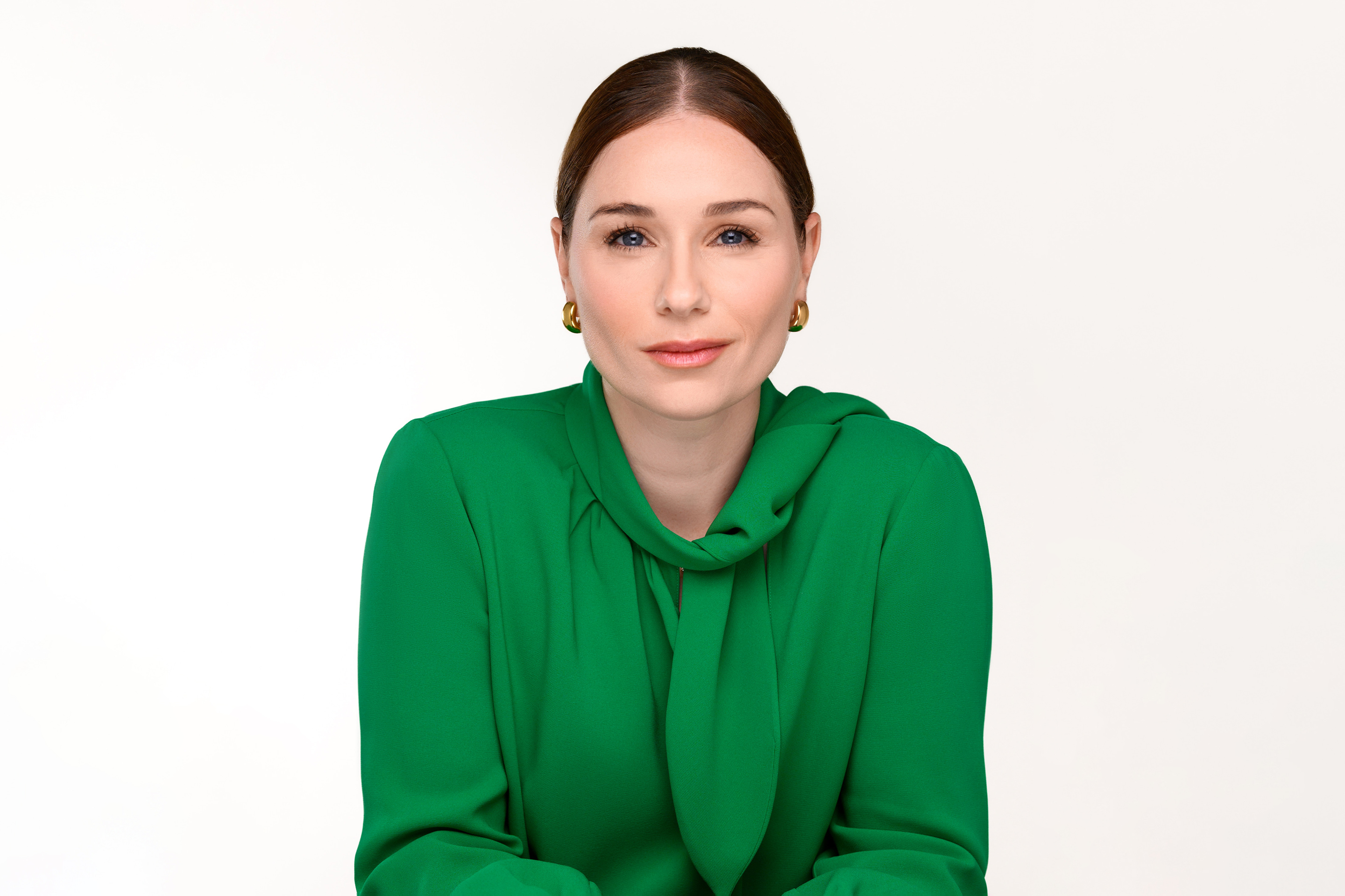 Woman wearing green blouse