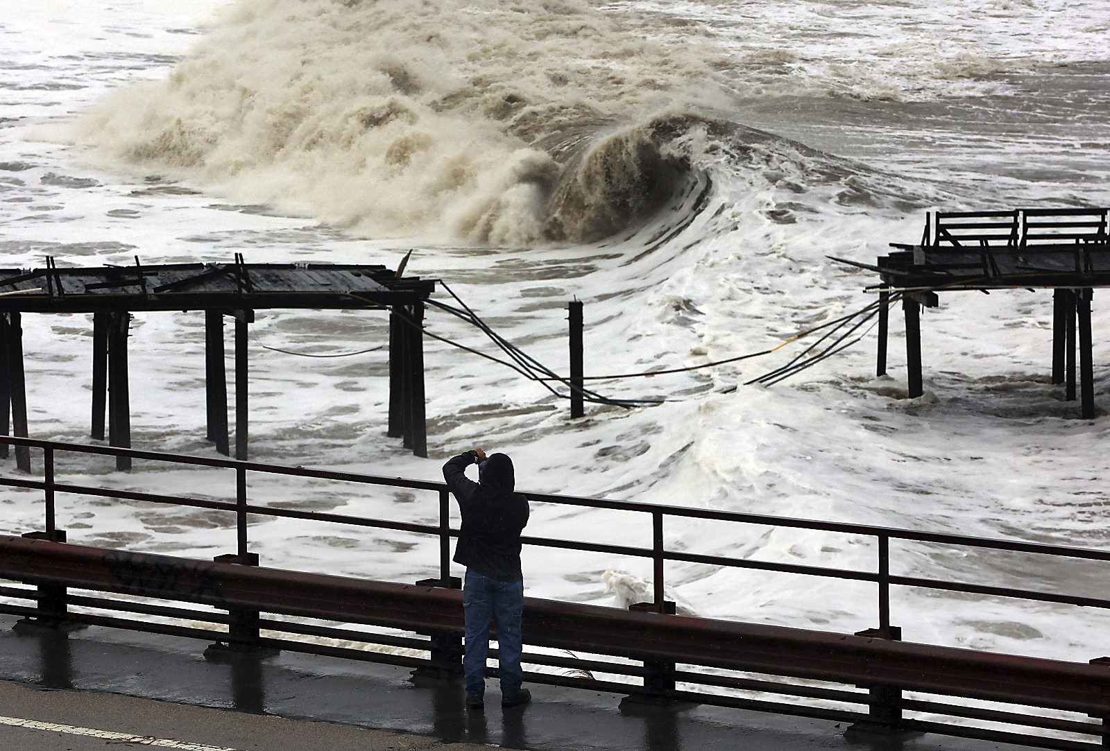 Powerful waves batter the Capitola Wharf after the storm destroyed a section of the structure on Jan. 5, 2023, in Capitola, Calif.