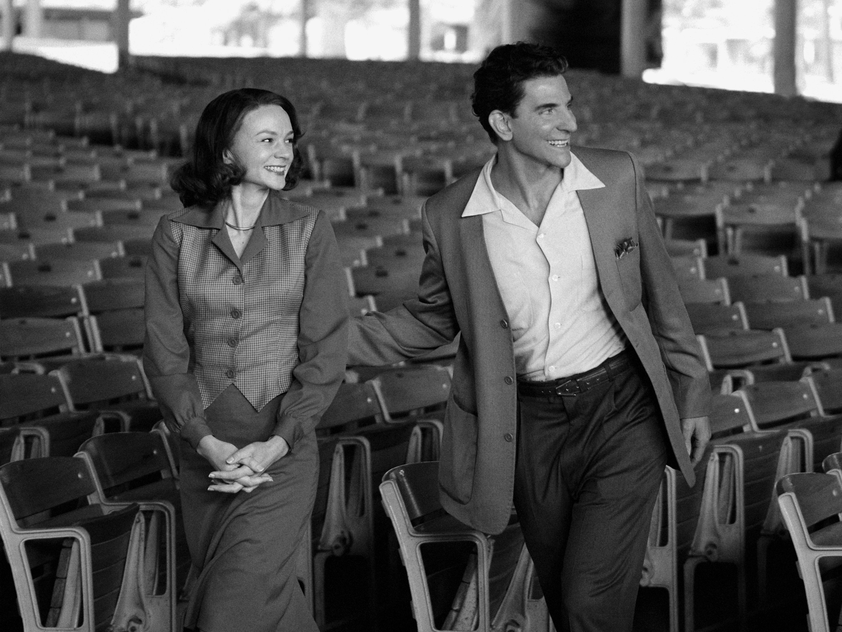 This image released by Netflix shows Carey Mulligan as Felicia Montealegre, left, and Bradley Cooper as Leonard Bernstein in a scene from "Maestro."