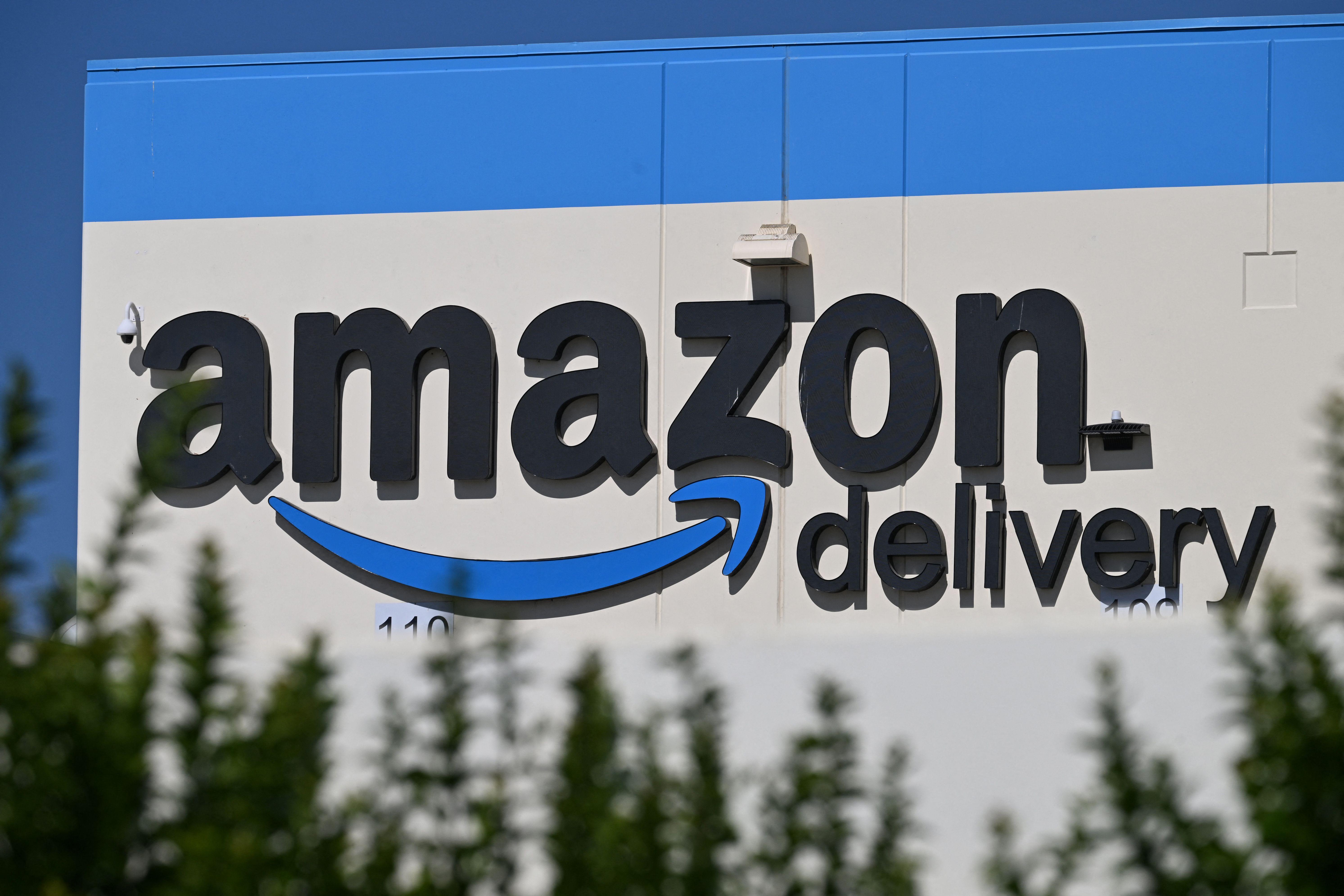 The Amazon delivery sign is seen on the exterior of the Amazon warehouse in Palmdale, California, on July 25, 2023.