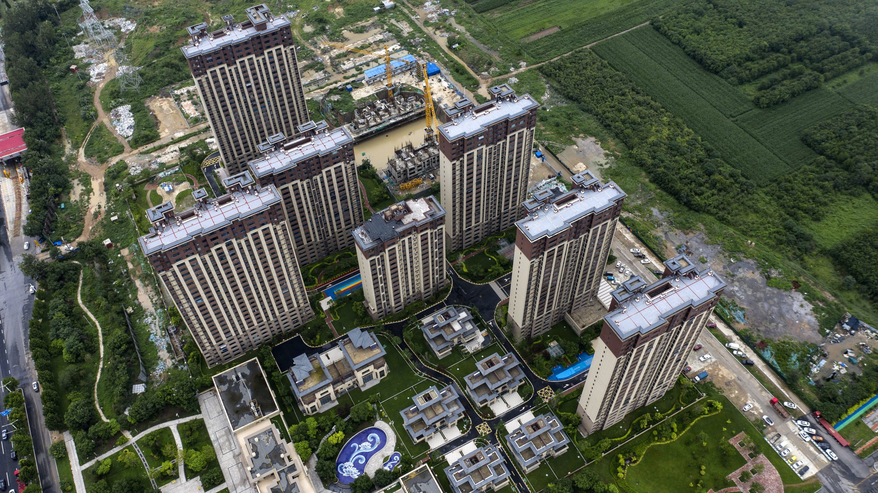 Residential buildings developed by Country Garden Holdings in Baoding, Hebei province, China. The developer slid in equity and credit markets after it canceled a share placement, adding to distress just as a cash crunch fuels concern about its ability to avoid a first-ever default.