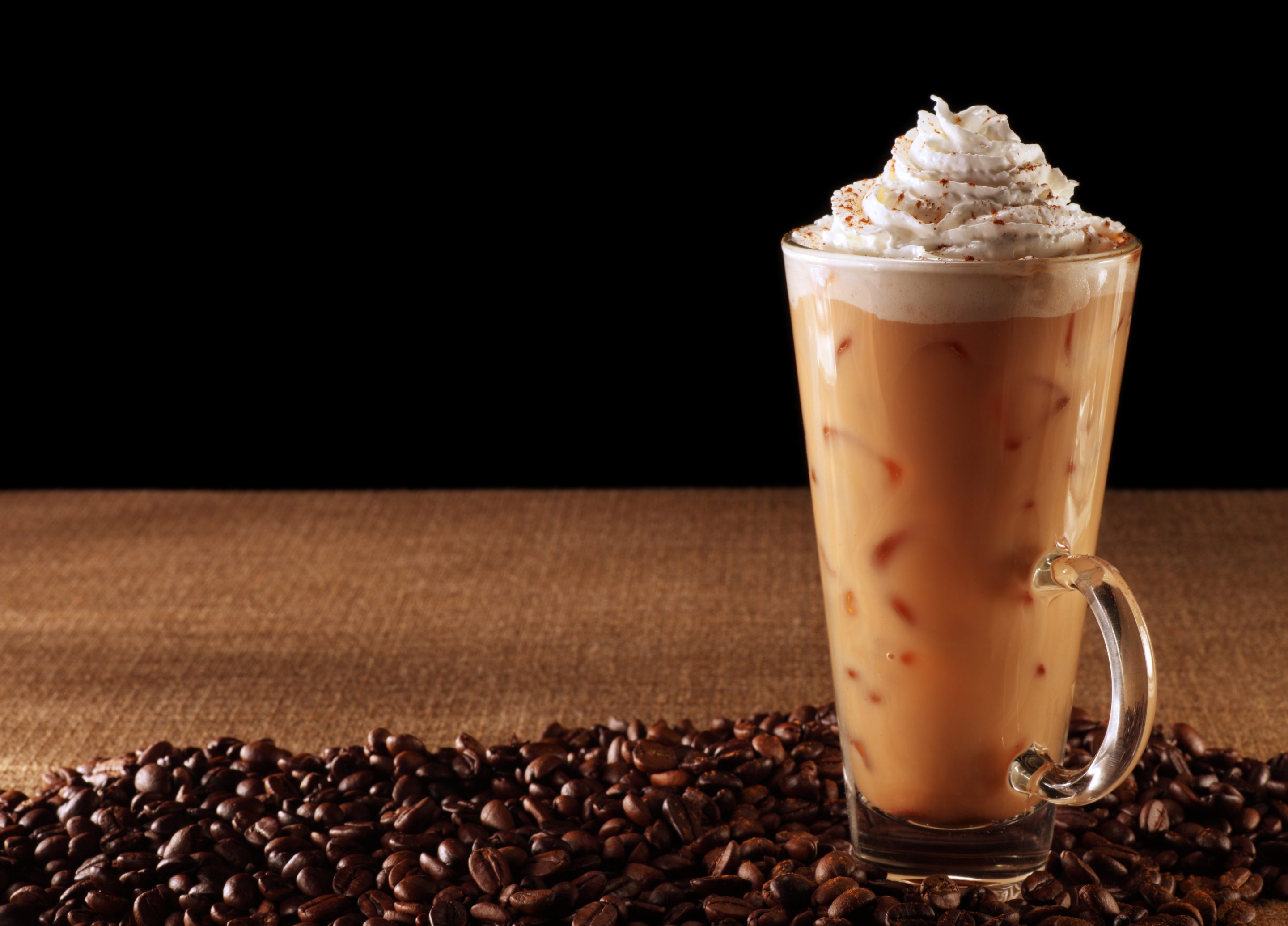 An iced pumpkin spice latte with whipped cream