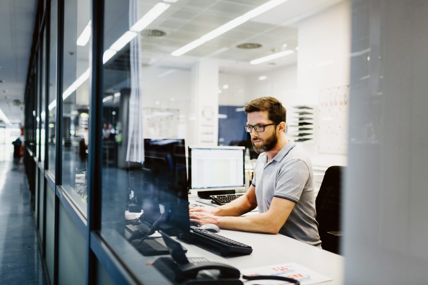 man at computer desk