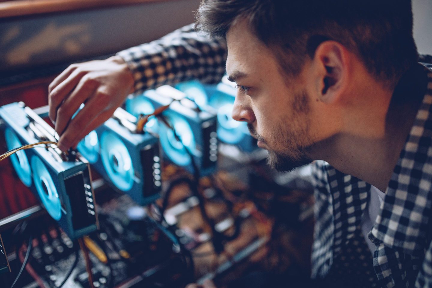 Programmer preparing mining rig for cryptocurrency mining