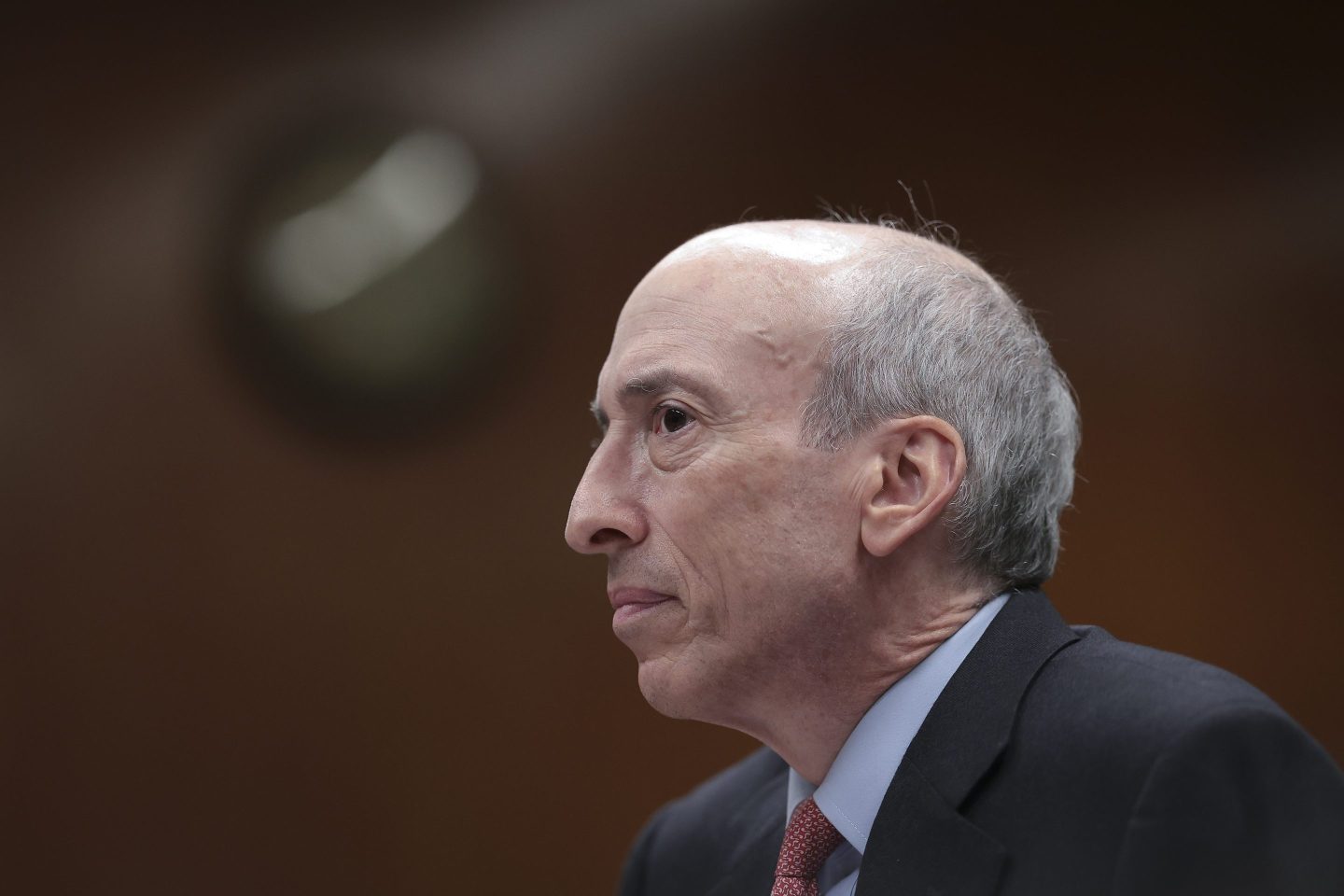Side profile view of man in suit and tie