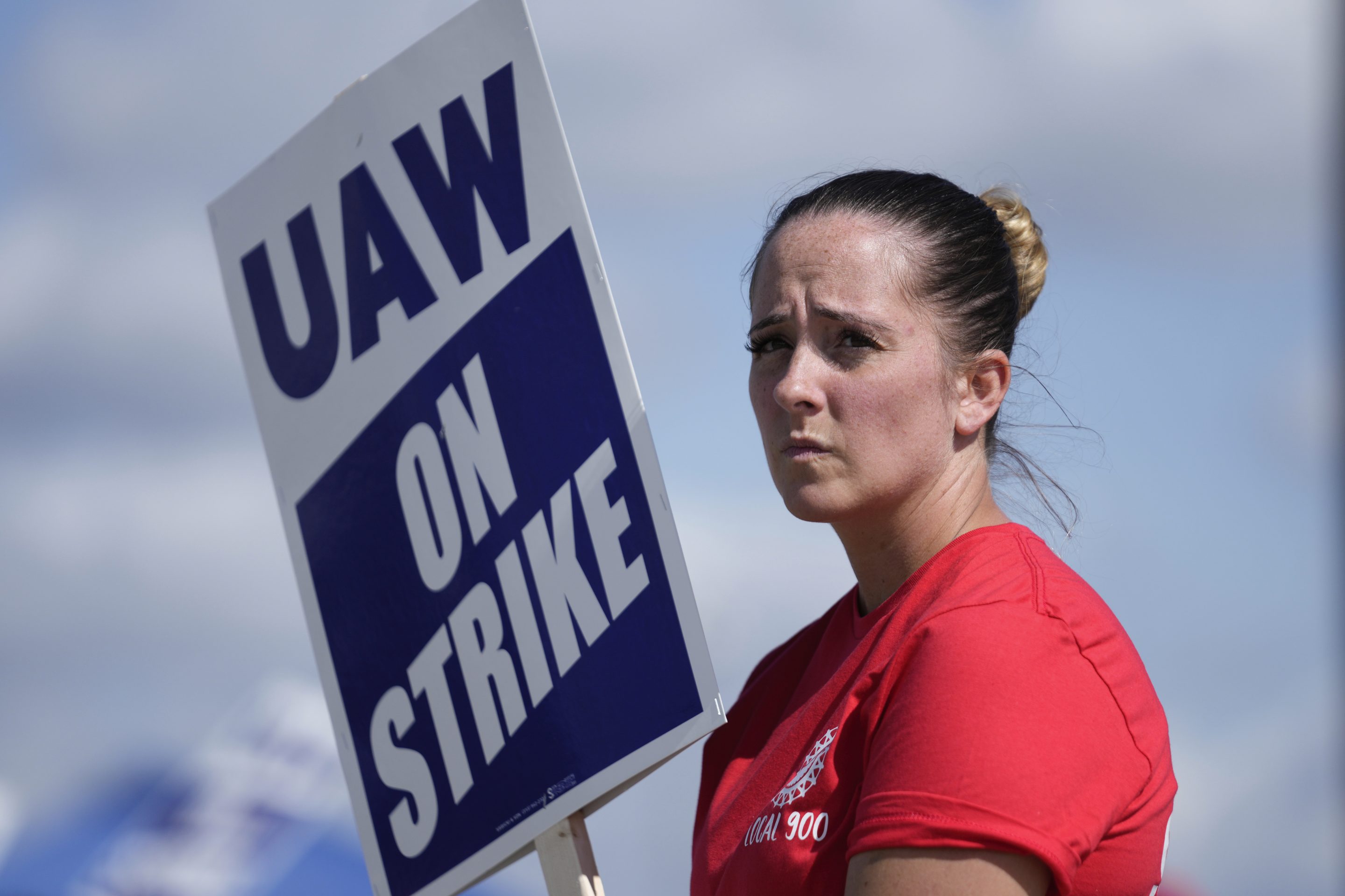 United Auto Workers member Victoria Hall walks the picket line at the Ford Michigan Assembly Plant in Wayne, Mich., on Sept. 18, 2023.