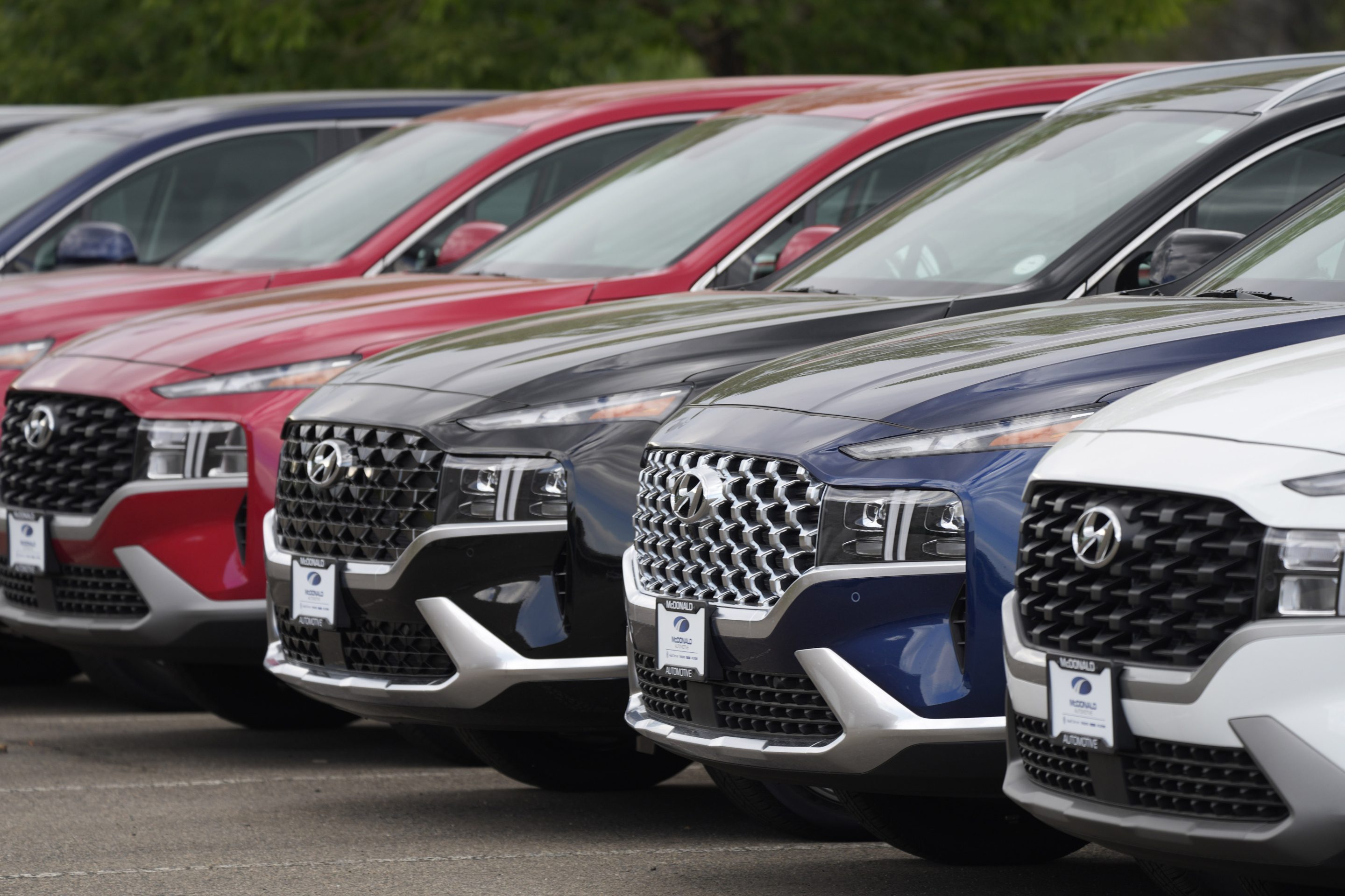 A line of 2022 Santa Fe SUV's sit outside a Hyundai dealership on Sept. 12, 2021, in Littleton, Colo.