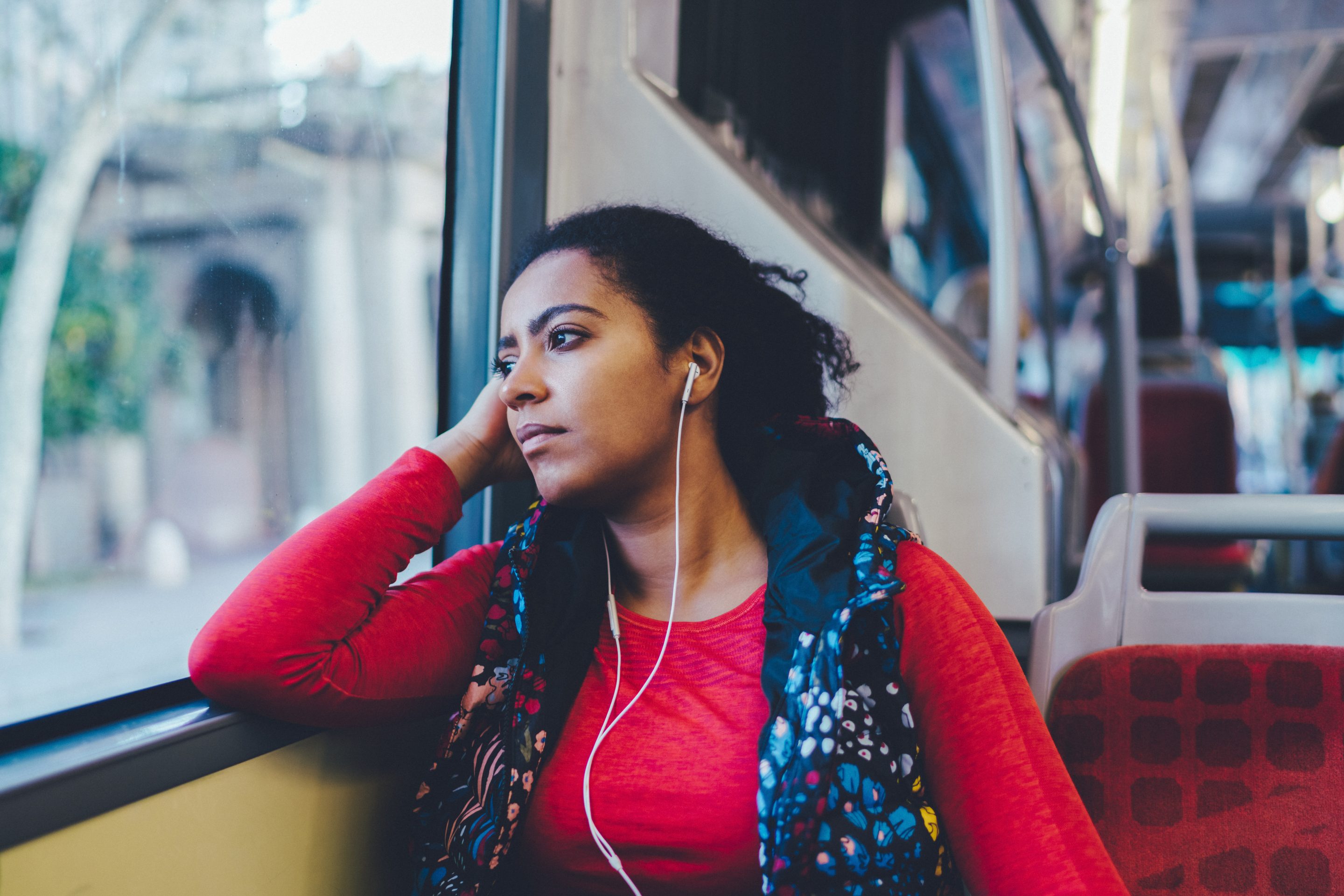 woman on bus looking forlorn