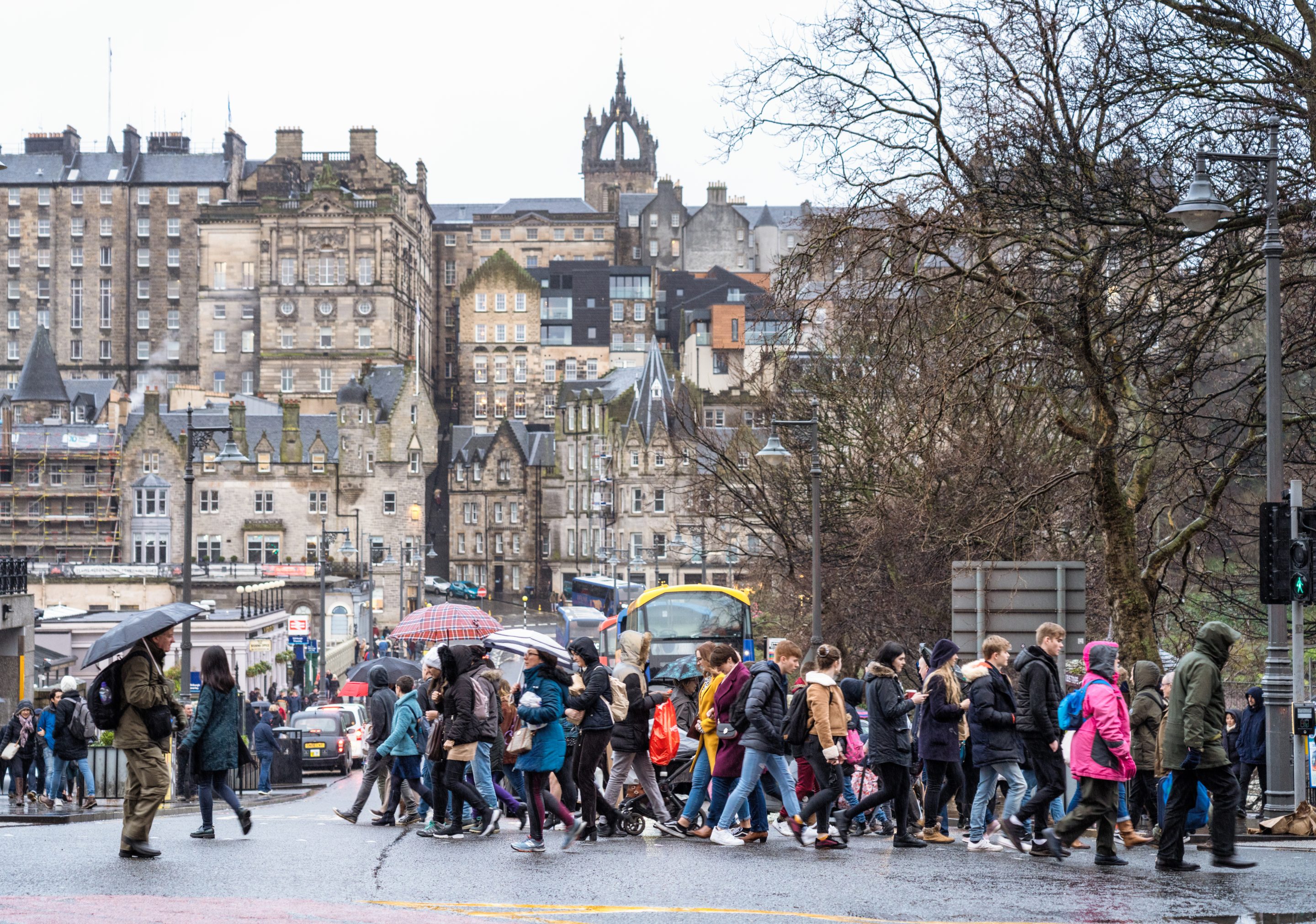 people walking on a busy street in Scotland