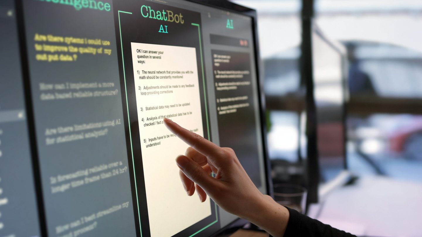 close-up stock photograph showing a touchscreen monitor being used