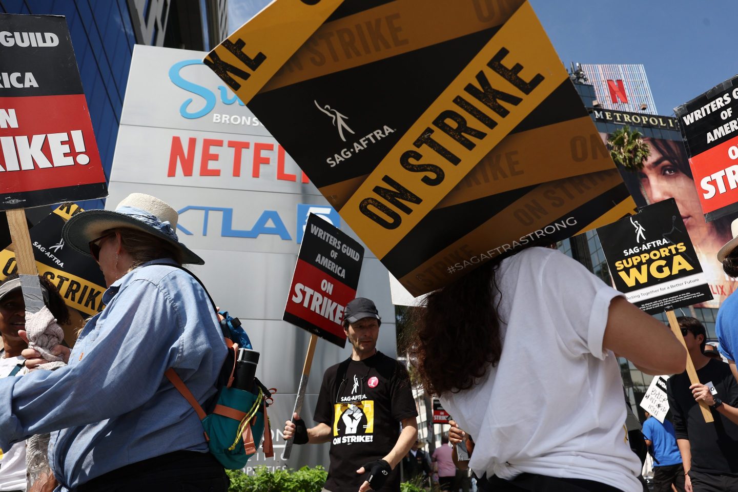 Writers and studios reach tentative deal to end 1 of 2 strikes that have shut down Hollywood