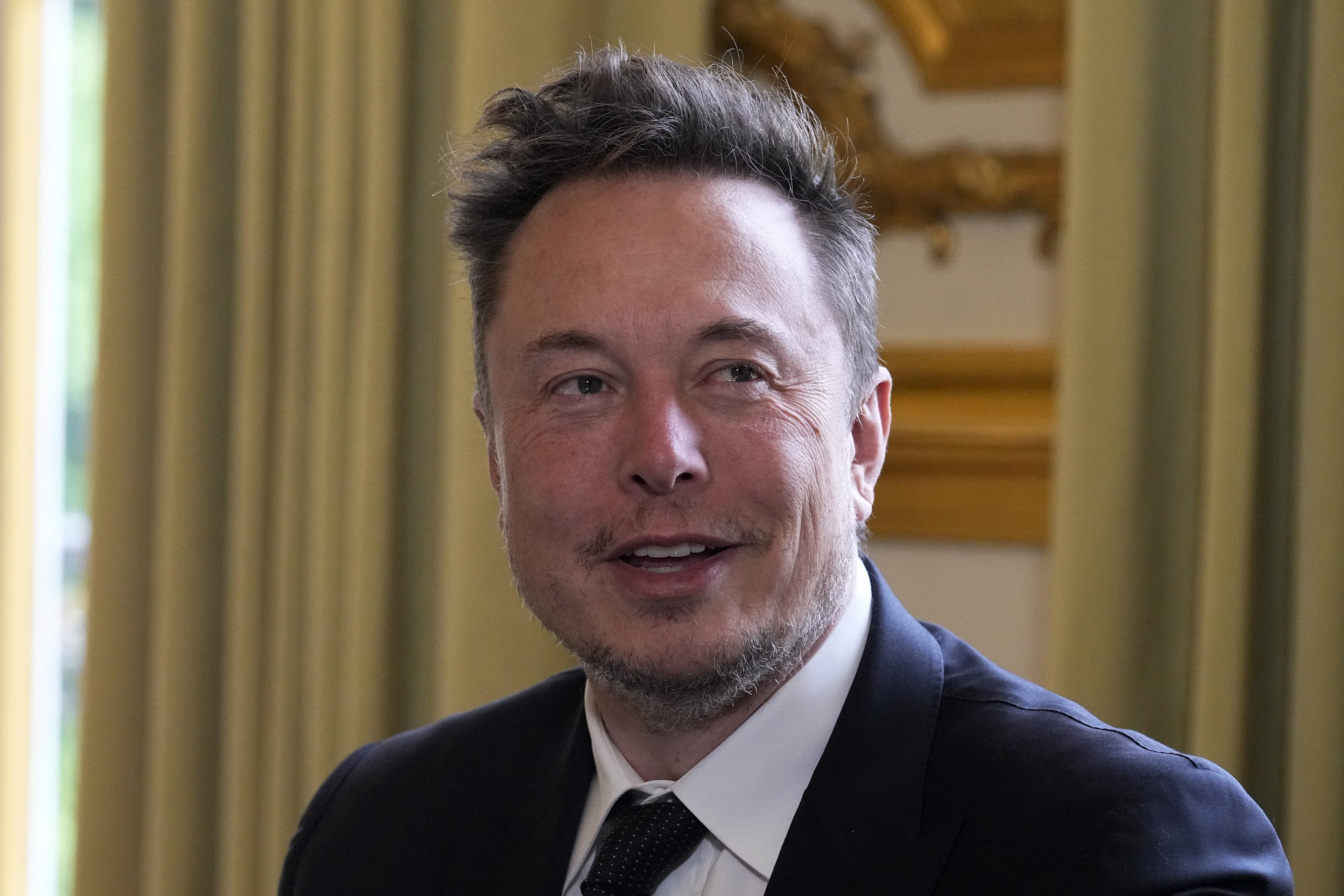 Twitter, now X. Corp., and Tesla CEO Elon Musk poses before his talks with French President Emmanuel Macron, on May 15, 2023, at the Elysee Palace in Paris.