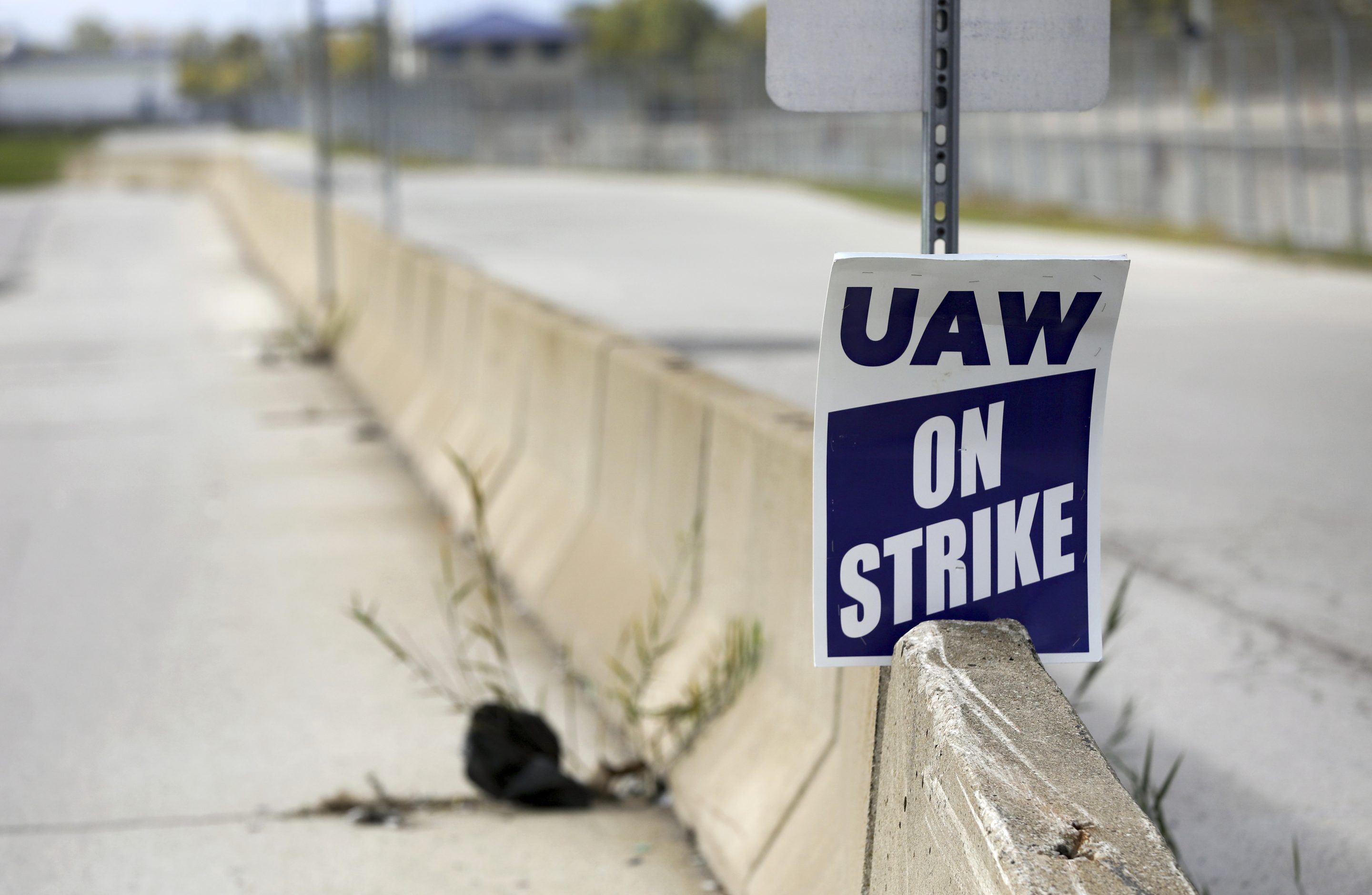 A strike sign is positioned at one of the gates during the ongoing United Auto Workers strike at the Stellantis Toledo Assembly Complex, on Oct. 7, 2023, in Toledo.
