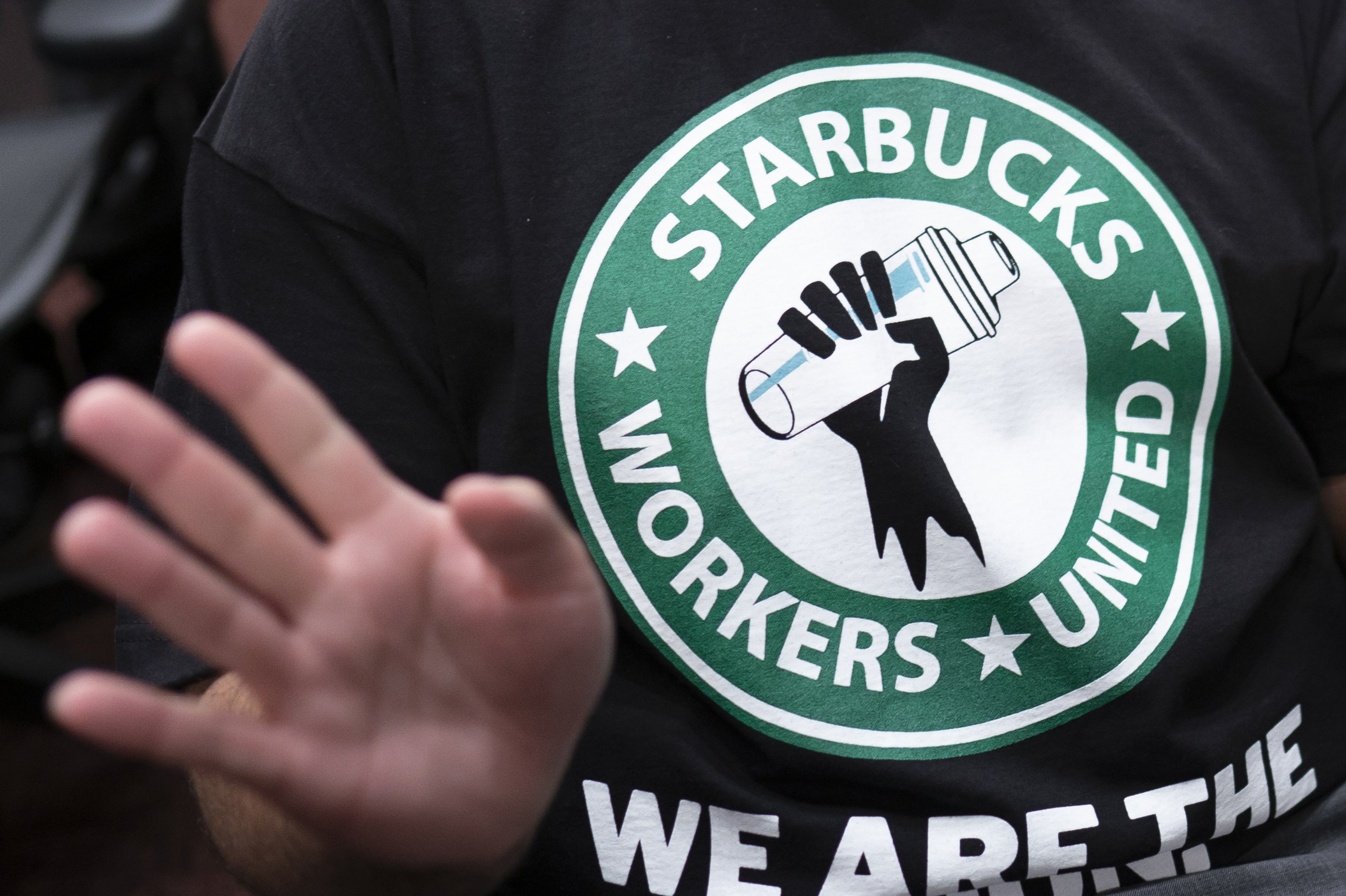 Starbucks Workers United logo featured on a black t-shirt