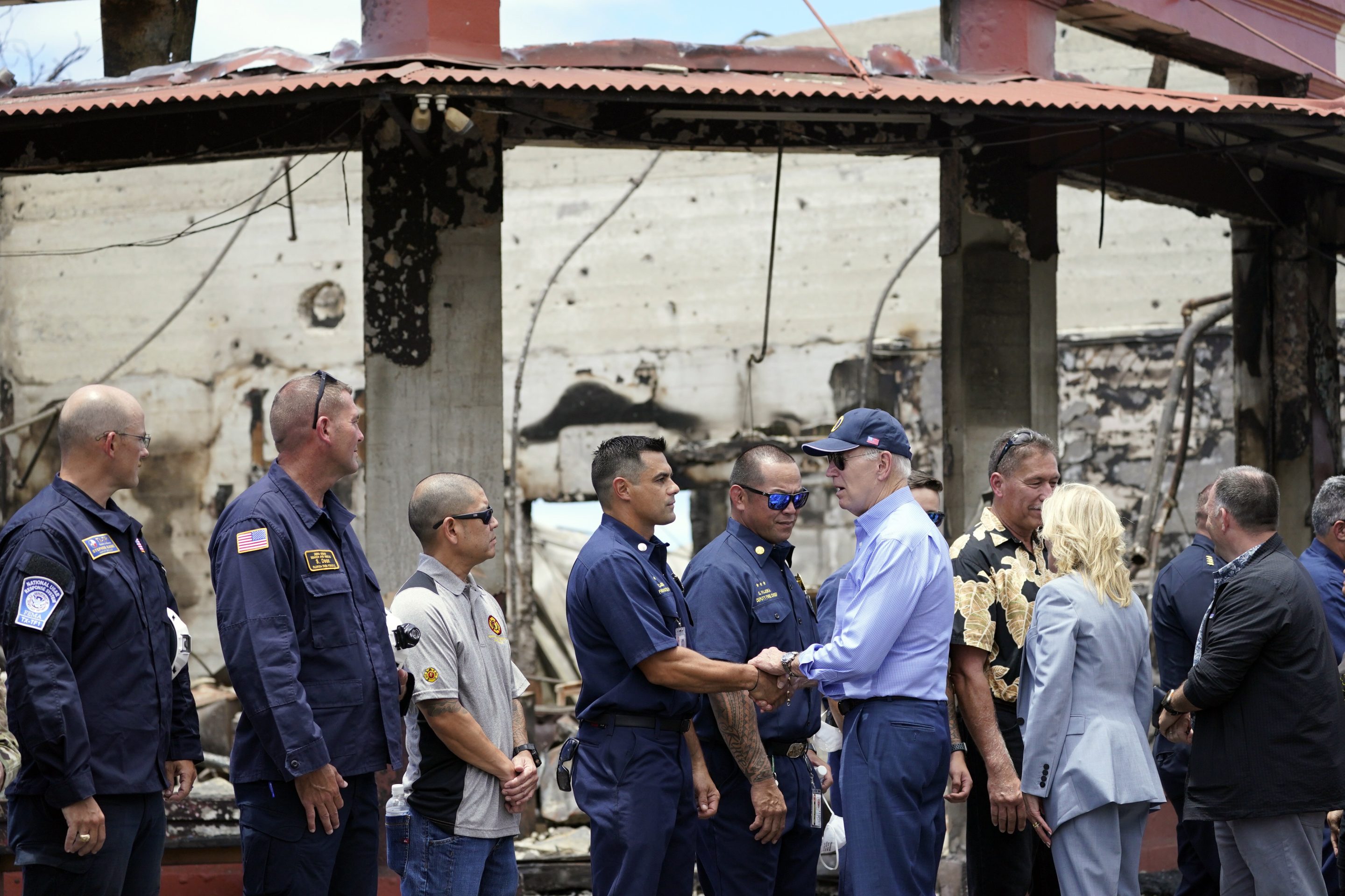 President Joe Biden and first lady Jill Biden greet first responders as they visit areas devastated by the Maui wildfires, Aug. 21, 2023, in Lahaina, Hawaii.