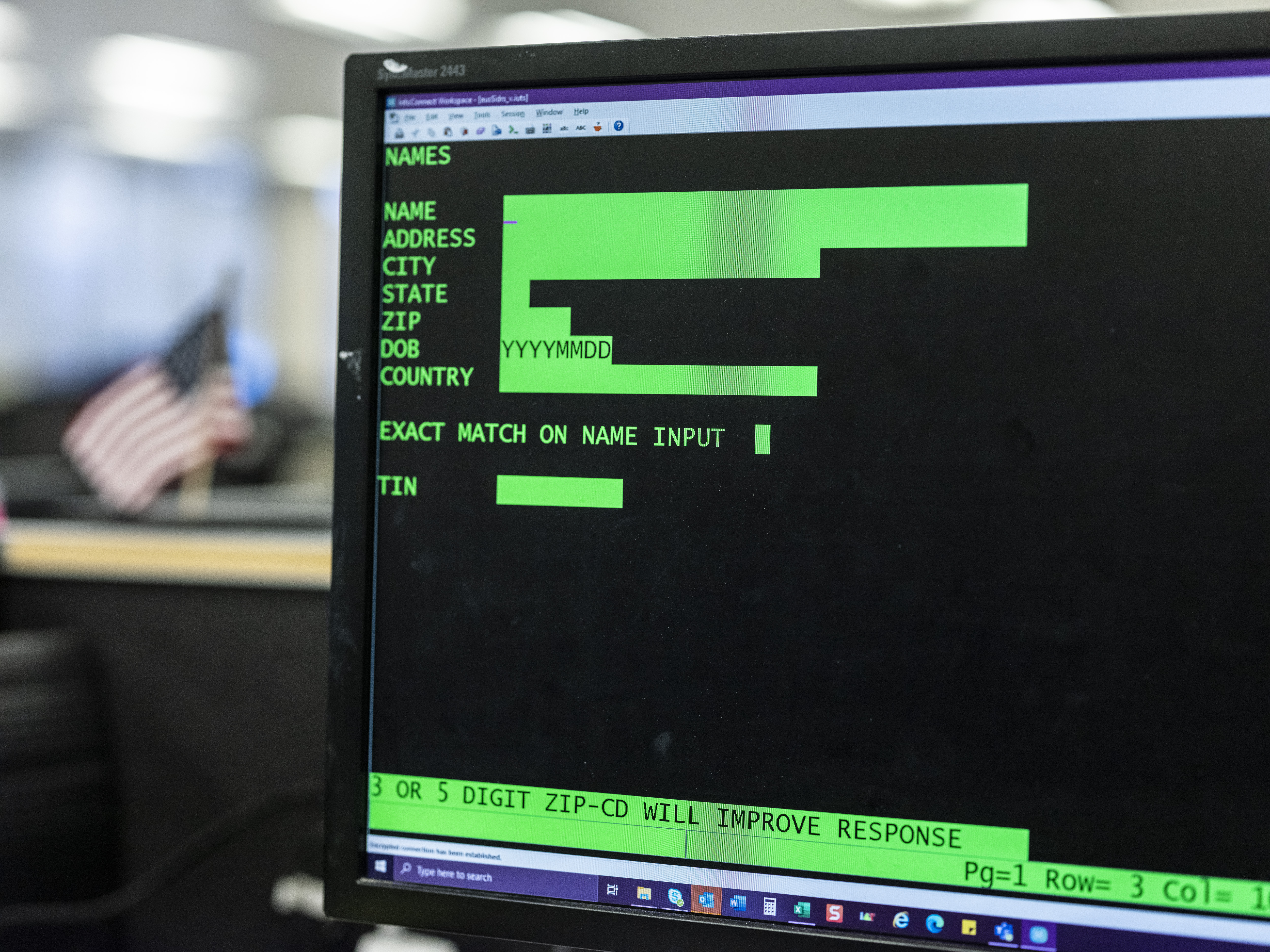 A computer running COBOL 73, an antiquated computer programming language, awaits taxpayer information entries.