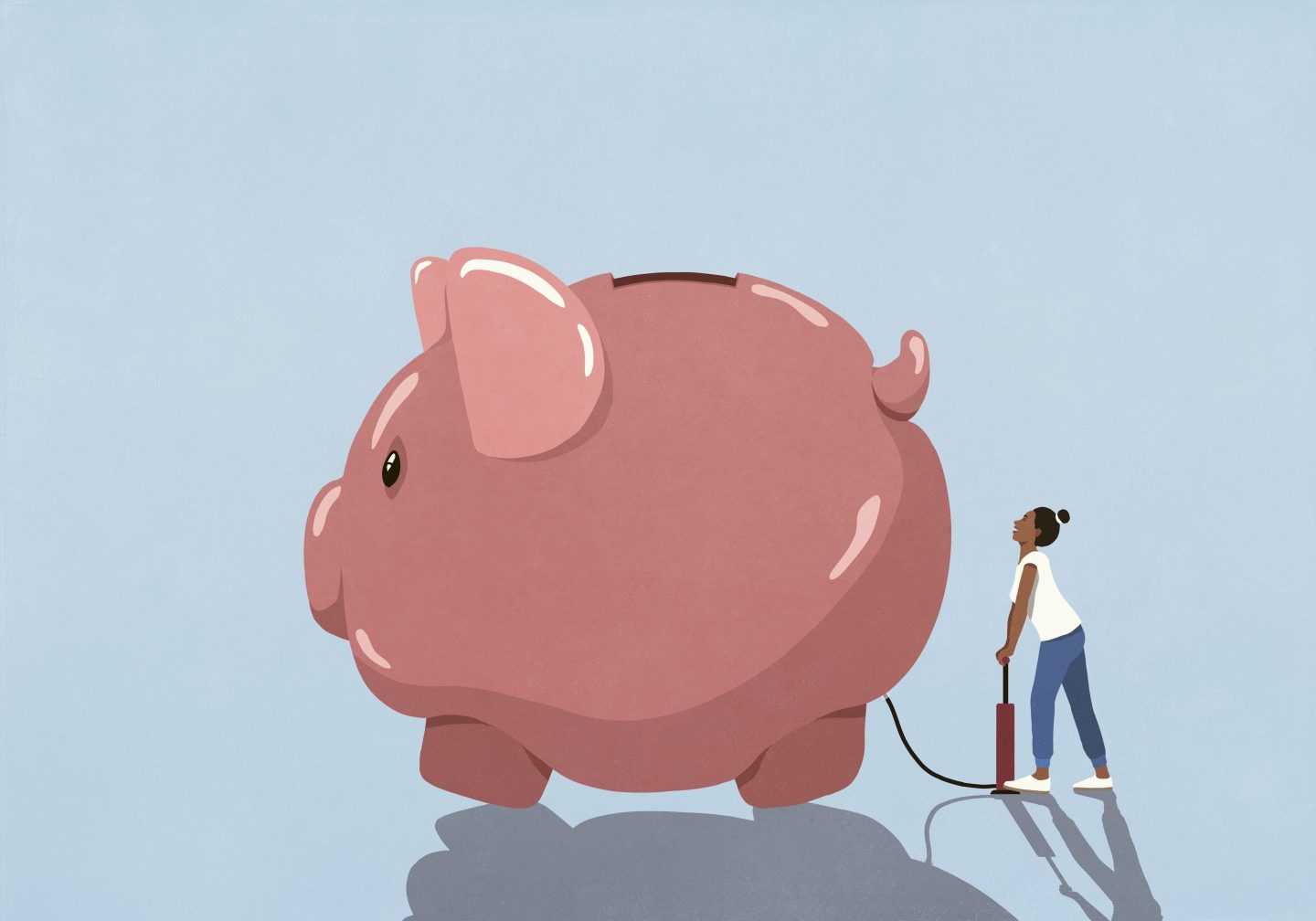 Woman inflating piggy bank with tire pump