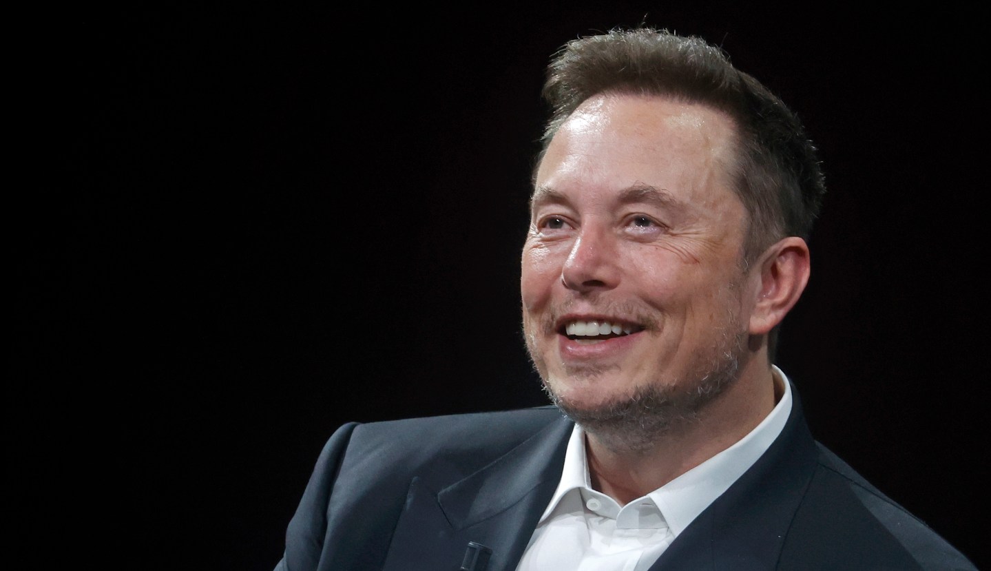 Elon Musk smiling.