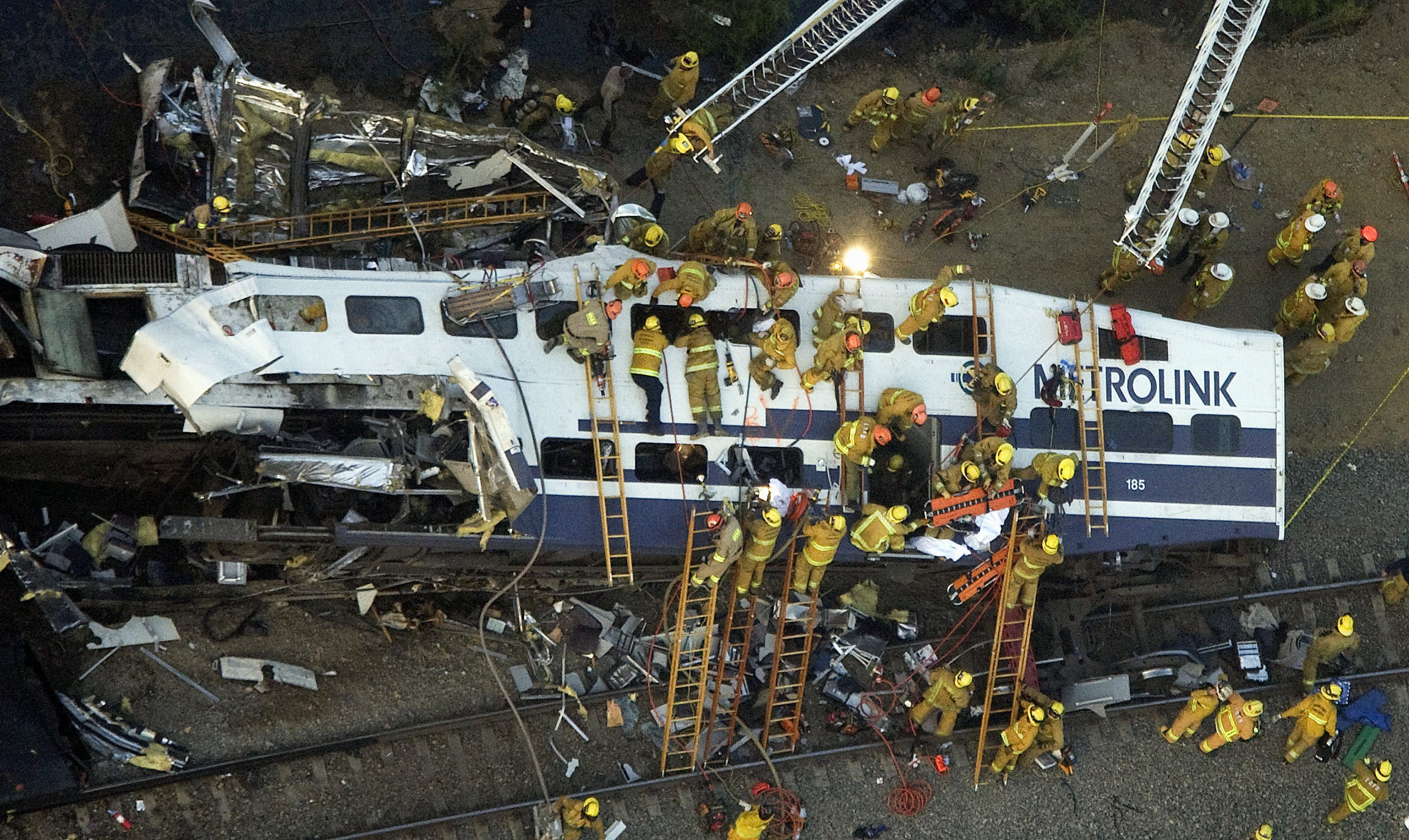 Rescue personnel work at the scene of a Metrolink commuter train collision in the Chatsworth area of Los Angeles, on Sept. 12, 2008.